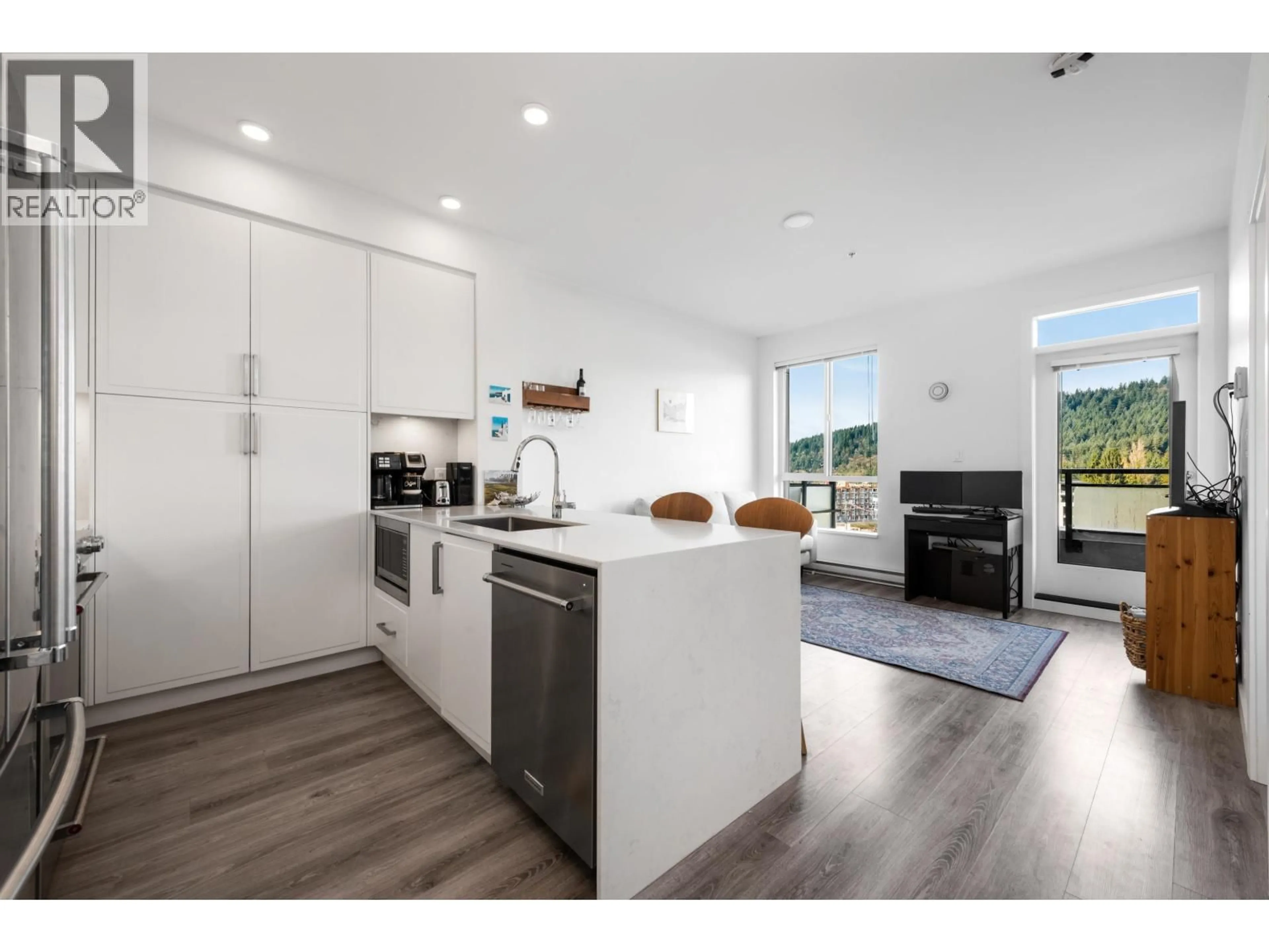 Open concept kitchen, wood/laminate floor for 609 - 700 CLARKE ROAD, Coquitlam British Columbia V3J0K5