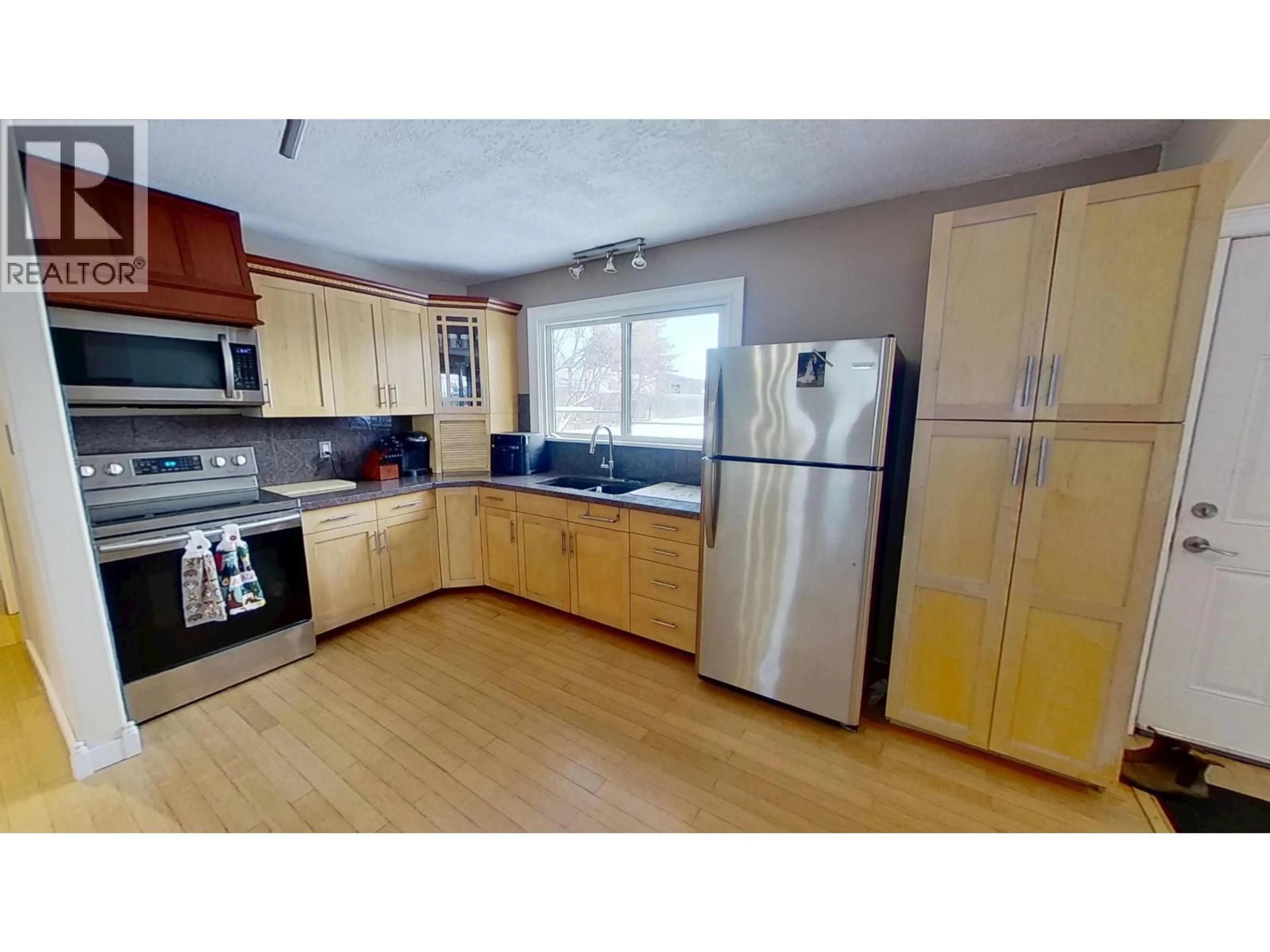 Standard kitchen, wood/laminate floor for 8824 PINE ROAD, Fort St. John British Columbia V1J4M7