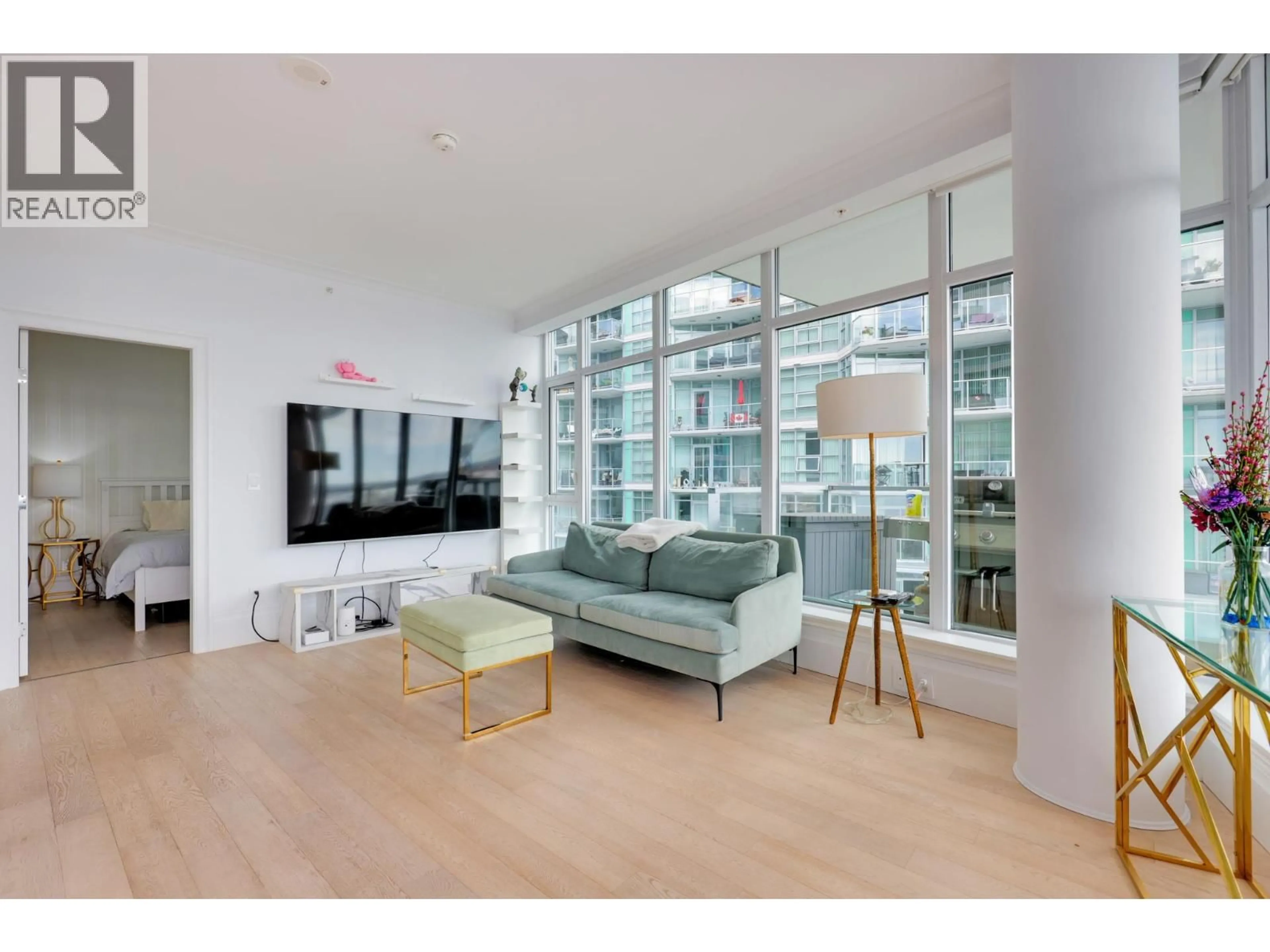 Living room with furniture, unknown for 501 - 185 VICTORY SHIP WAY, North Vancouver British Columbia V7L0G2