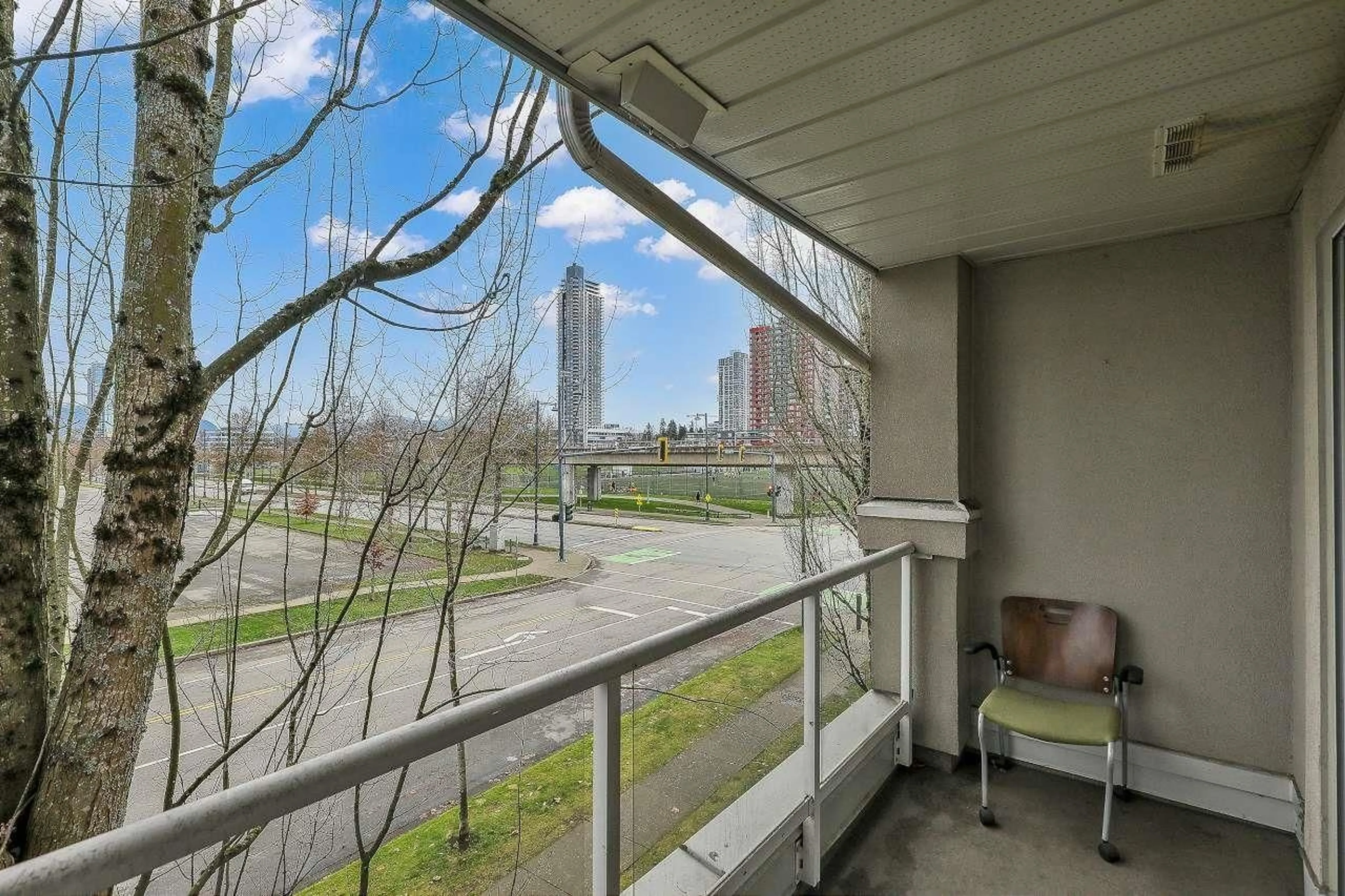 Balcony in the apartment, city buildings view from balcony for 308 - 10533 UNIVERSITY DRIVE, Surrey British Columbia V3T5T7