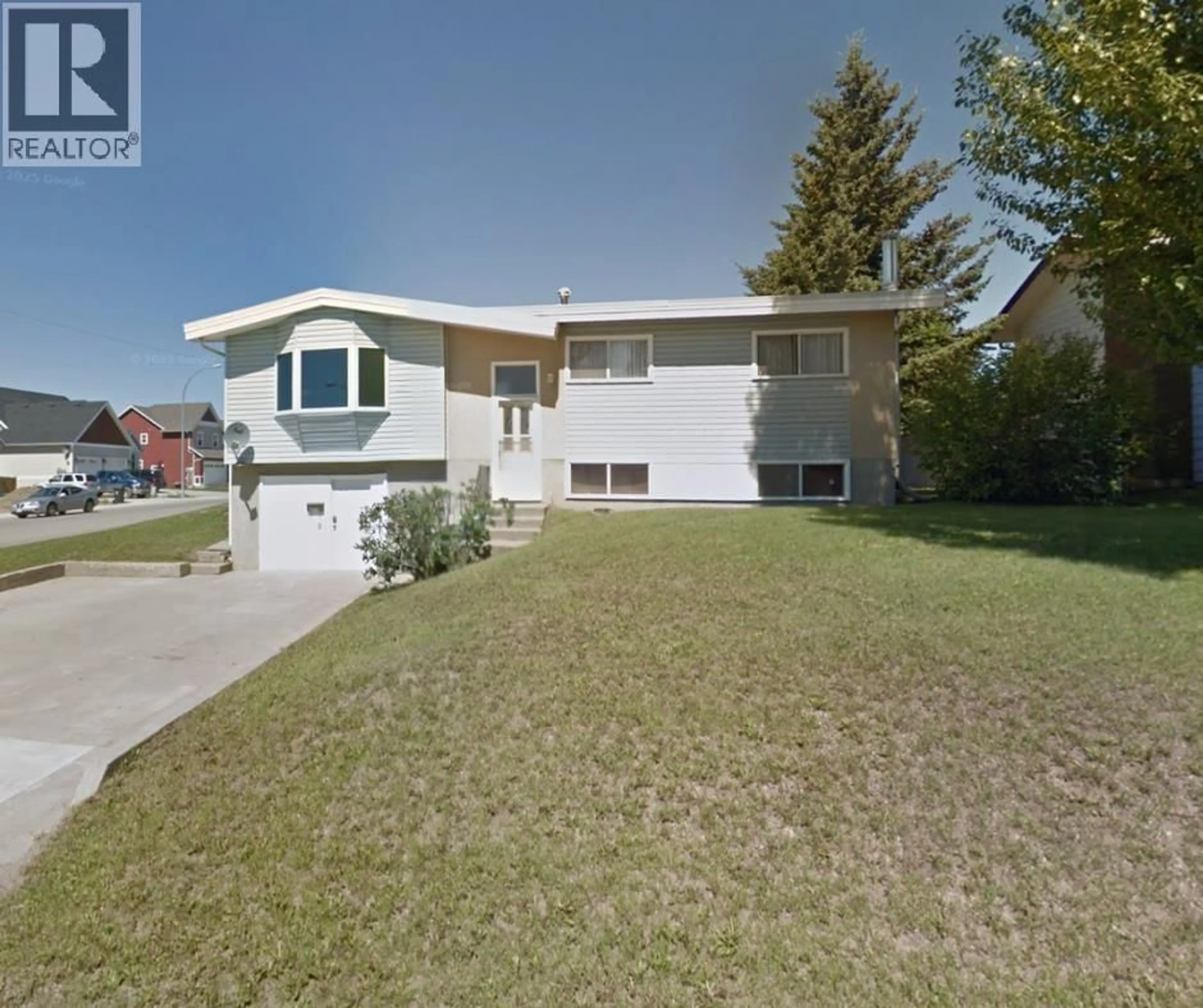 A pic from outside/outdoor area/front of a property/back of a property/a pic from drone, street for 10716 105 AVENUE, Fort St. John British Columbia V1J2N1