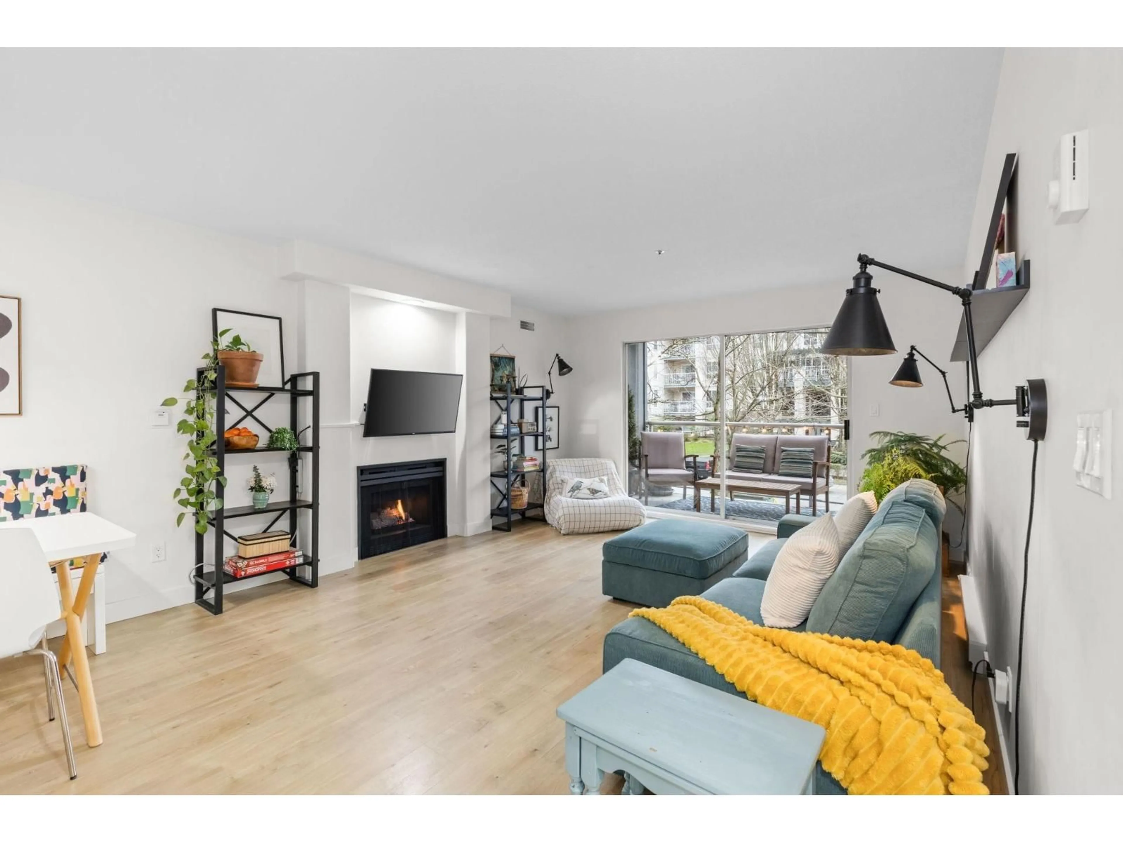 Living room with furniture, wood/laminate floor for 104 - 20177 54A AVENUE, Langley British Columbia V3A3W6