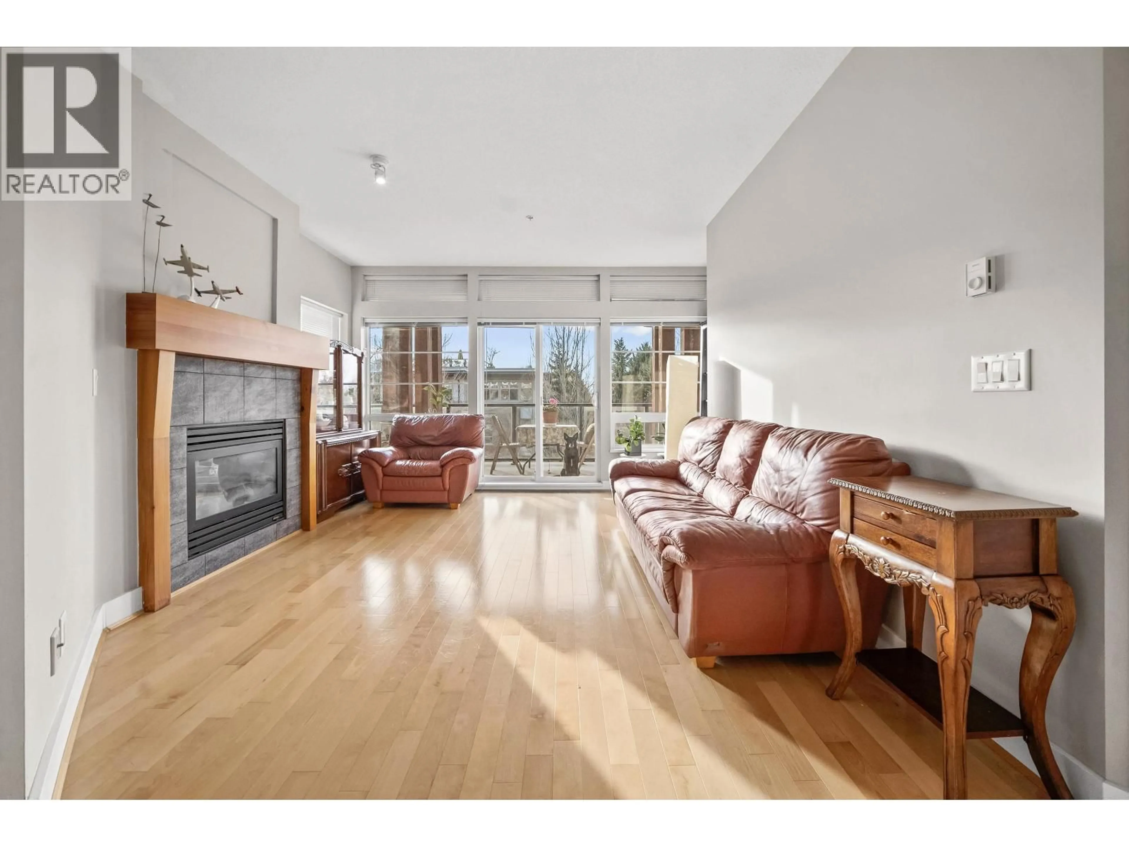 Living room with furniture, wood/laminate floor for 300 - 6328 LARKIN DRIVE, Vancouver British Columbia V6T2K2