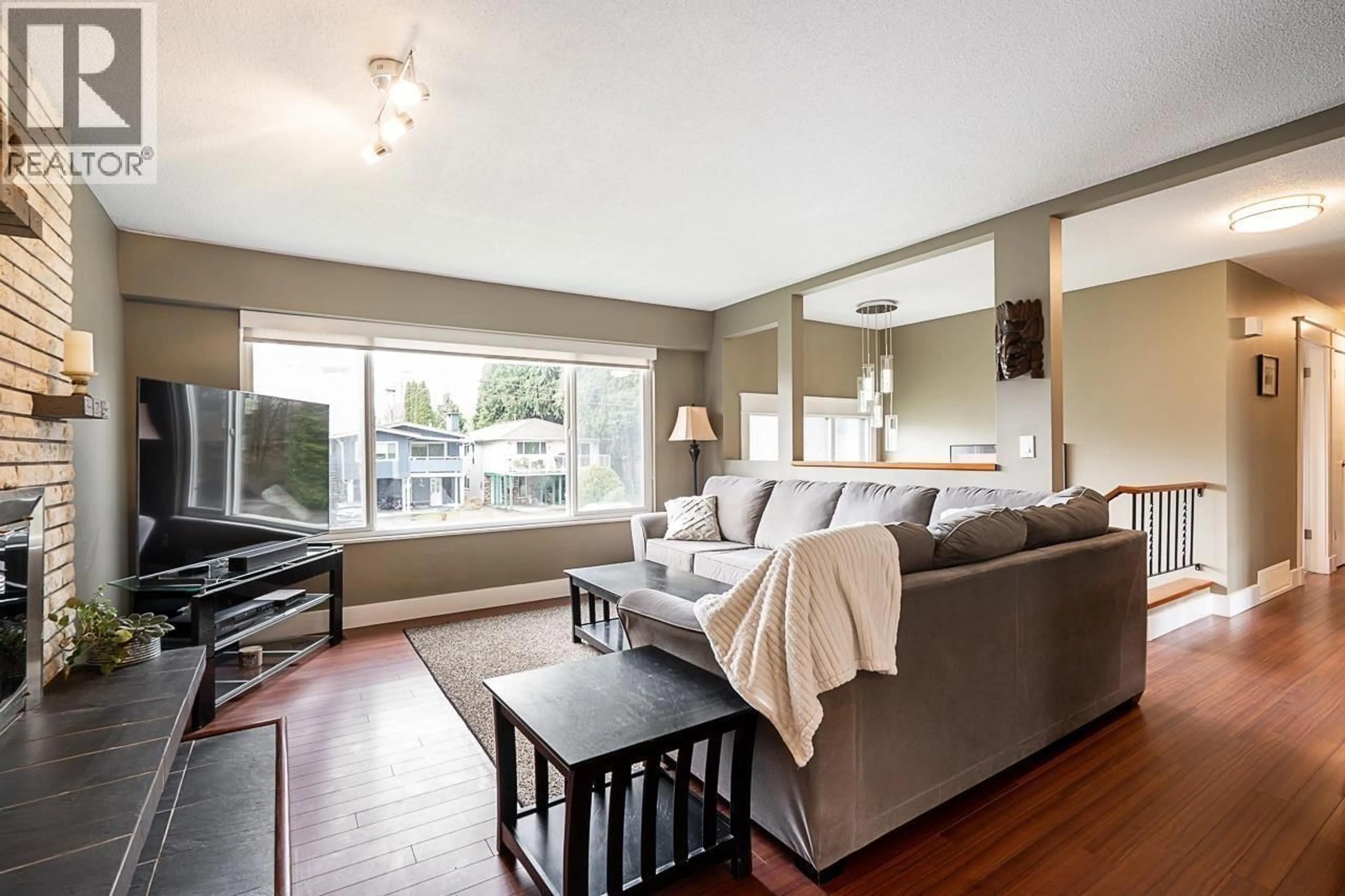 Living room with furniture, wood/laminate floor for 2259 PRAIRIE AVENUE, Port Coquitlam British Columbia V3B1V8