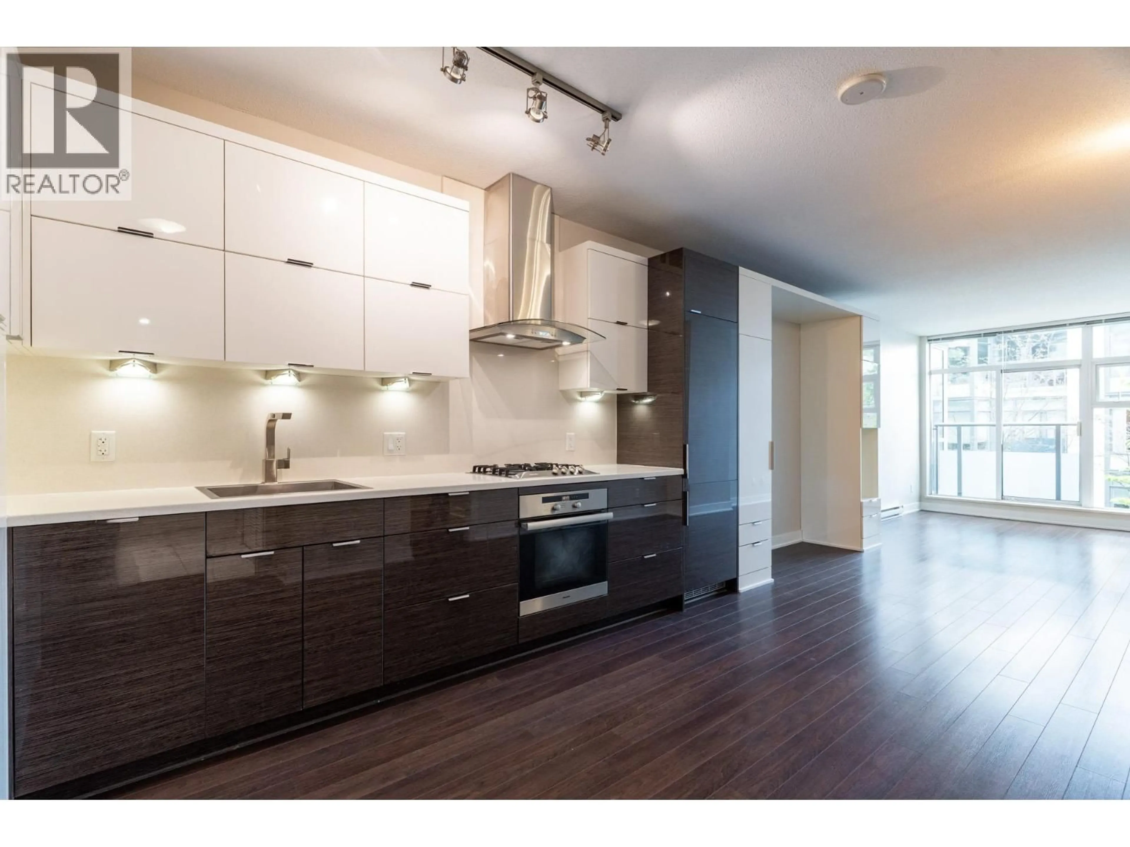 Open concept kitchen, wood/laminate floor for 202 - 1777 7TH AVENUE, Vancouver British Columbia V6J0E5