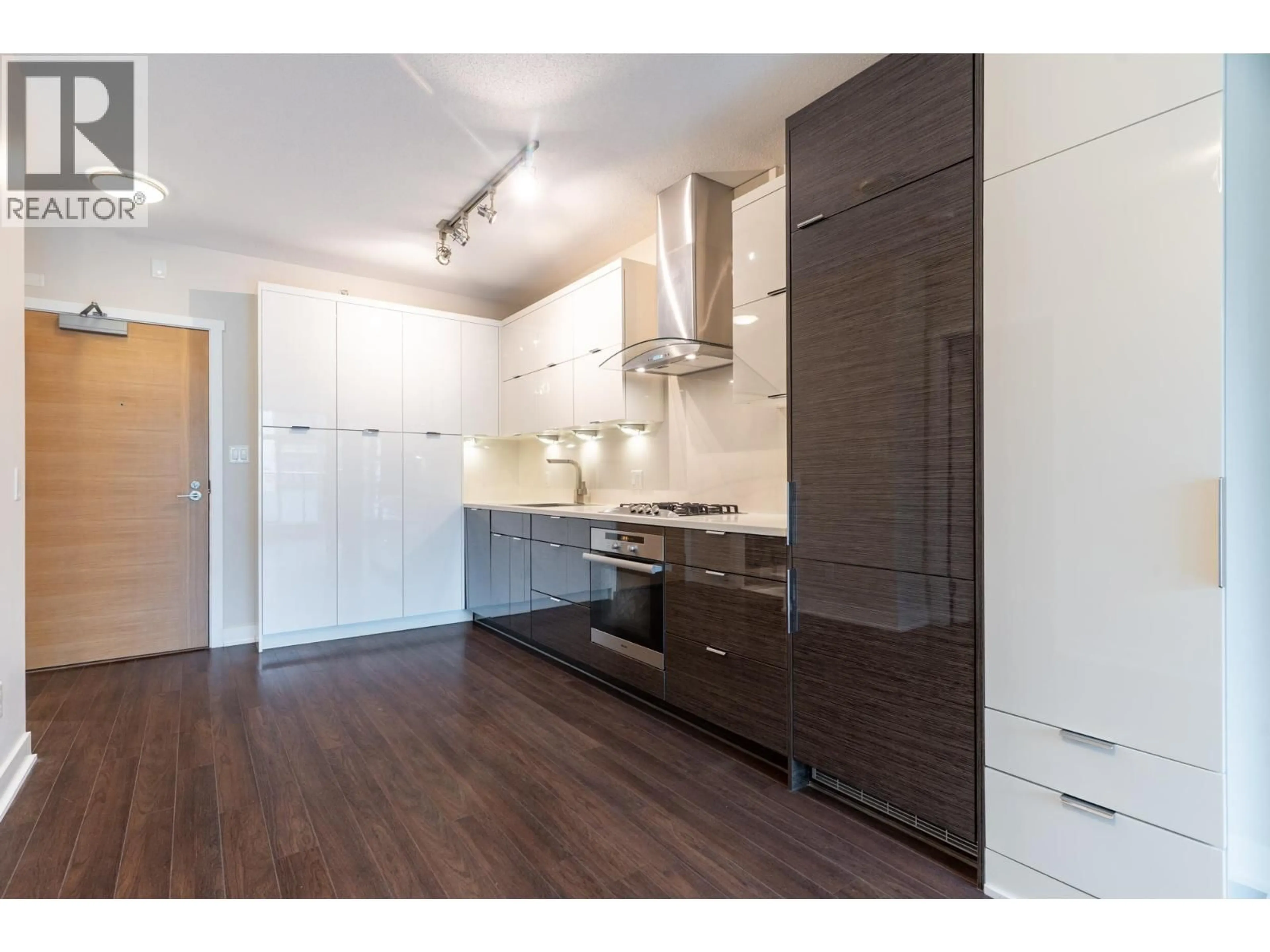 Open concept kitchen, wood/laminate floor for 202 - 1777 7TH AVENUE, Vancouver British Columbia V6J0E5