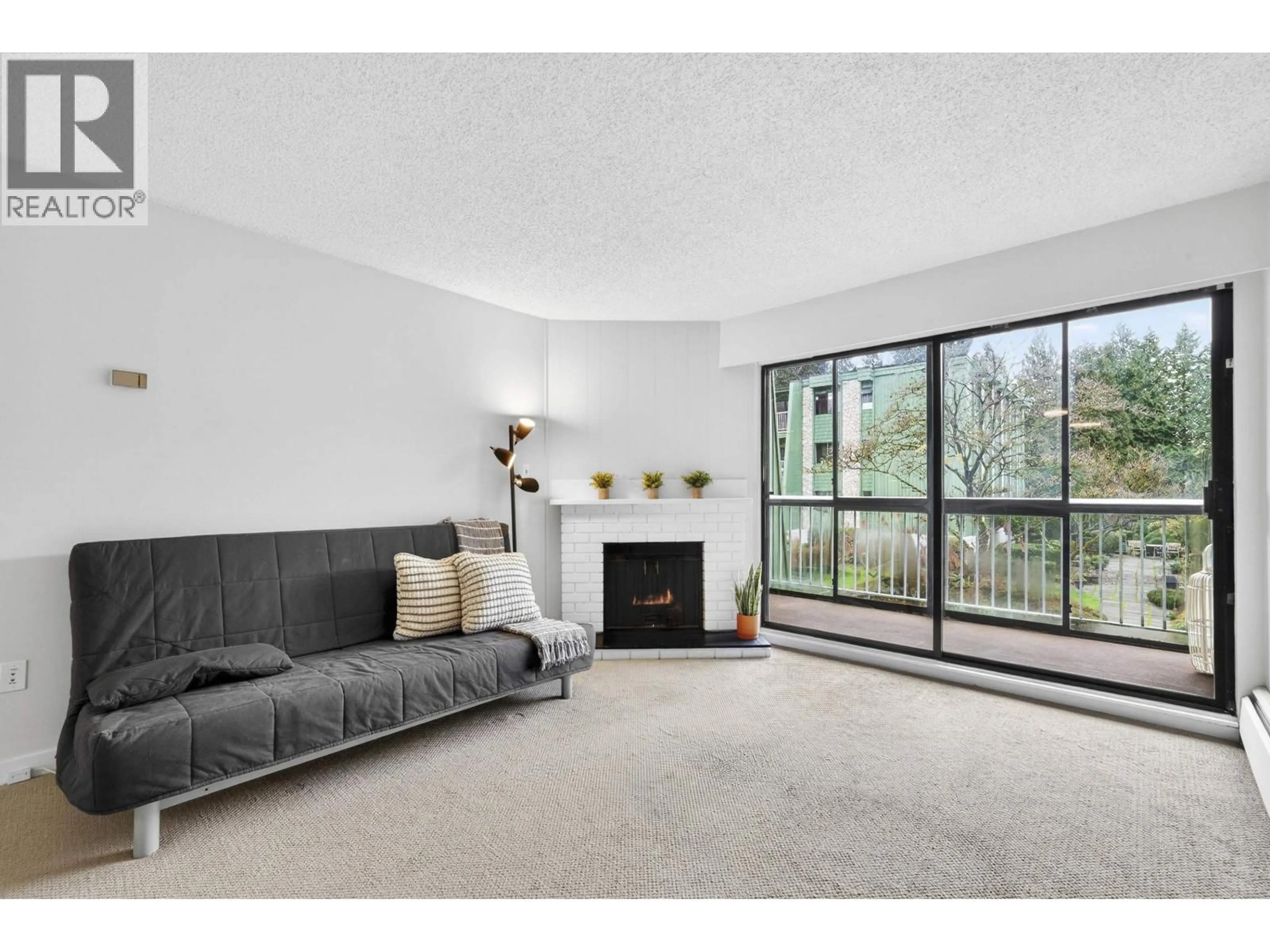 Living room with furniture, unknown for 206 - 9202 HORNE STREET, Burnaby British Columbia V3N4K2