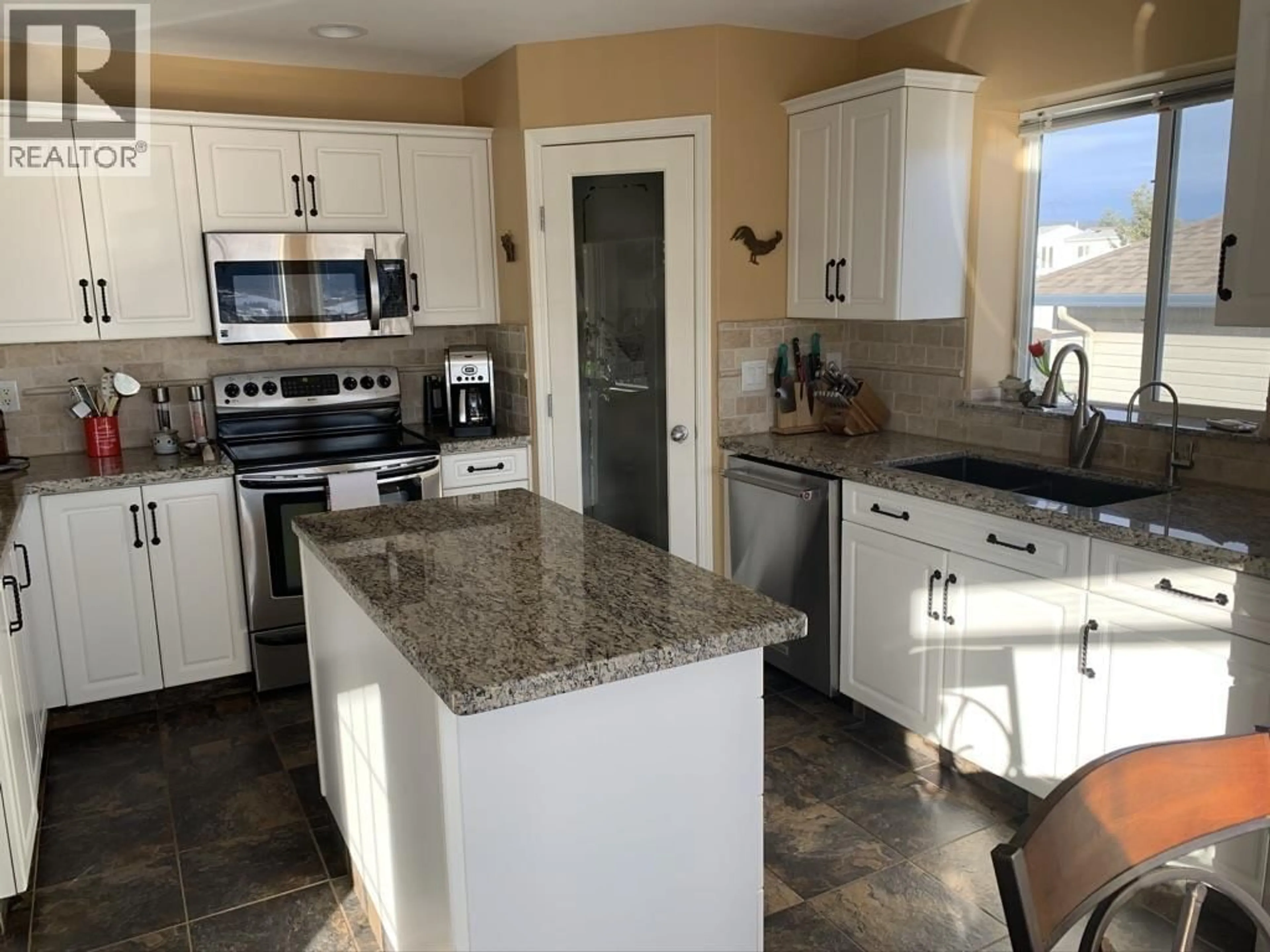 Open concept kitchen, ceramic/tile floor for 344 MANDARINO PLACE, Williams Lake British Columbia V2G5J1