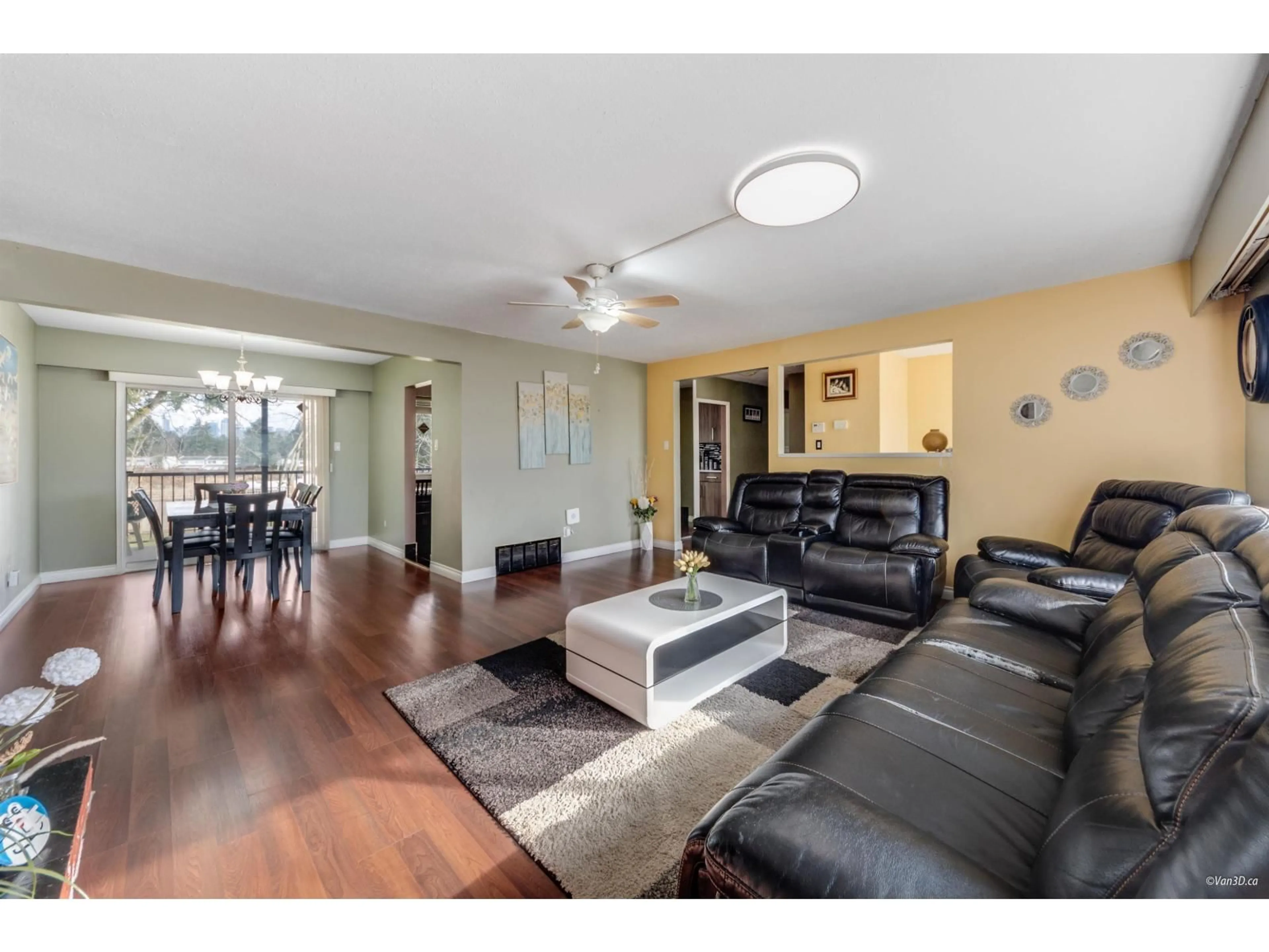 Living room with furniture, wood/laminate floor for 13553 84 AVENUE, Surrey British Columbia V3W3H3