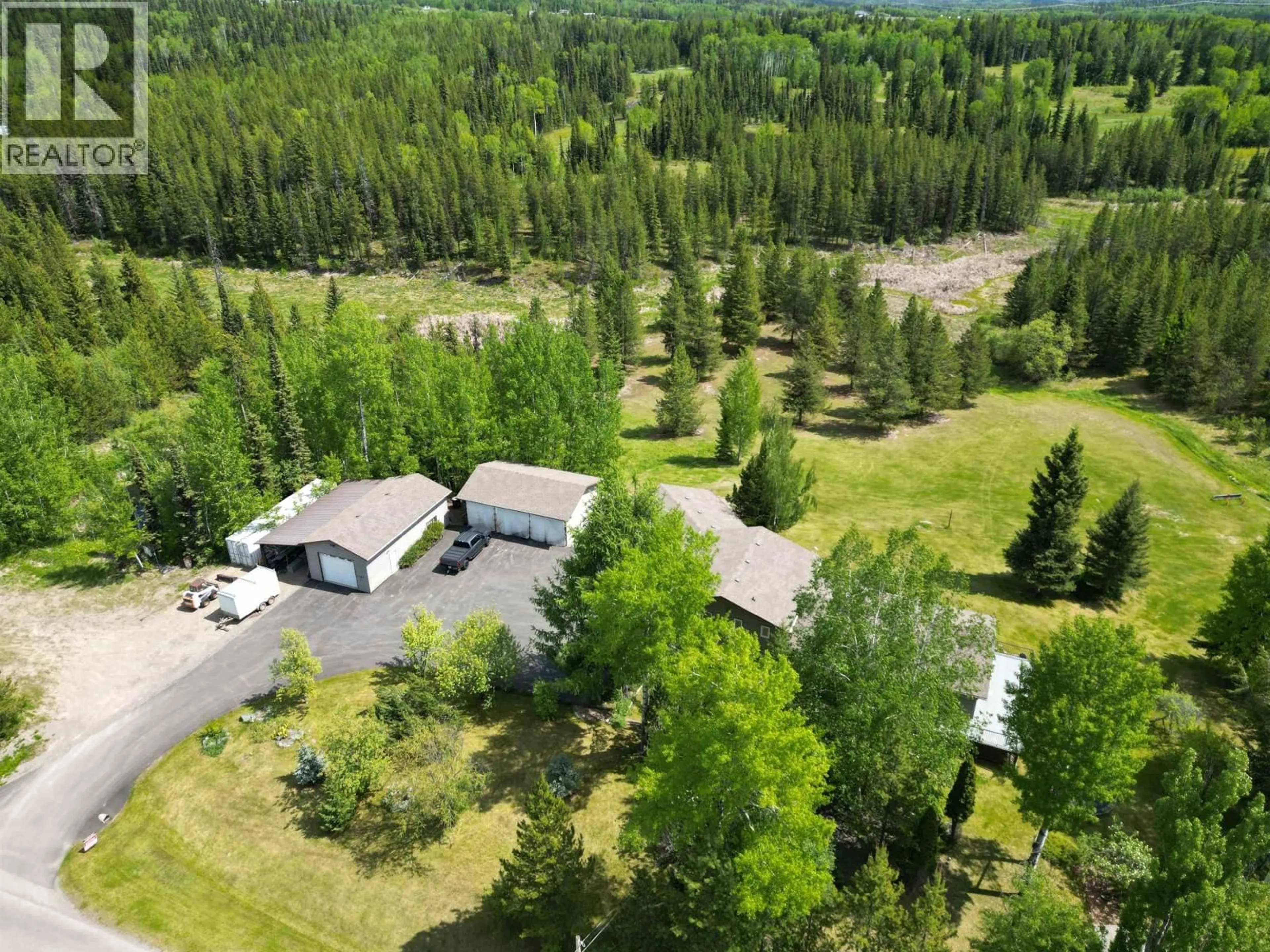 A pic from outside/outdoor area/front of a property/back of a property/a pic from drone, forest/trees view for 11400 MAURAEN DRIVE, Prince George British Columbia V2N5B7