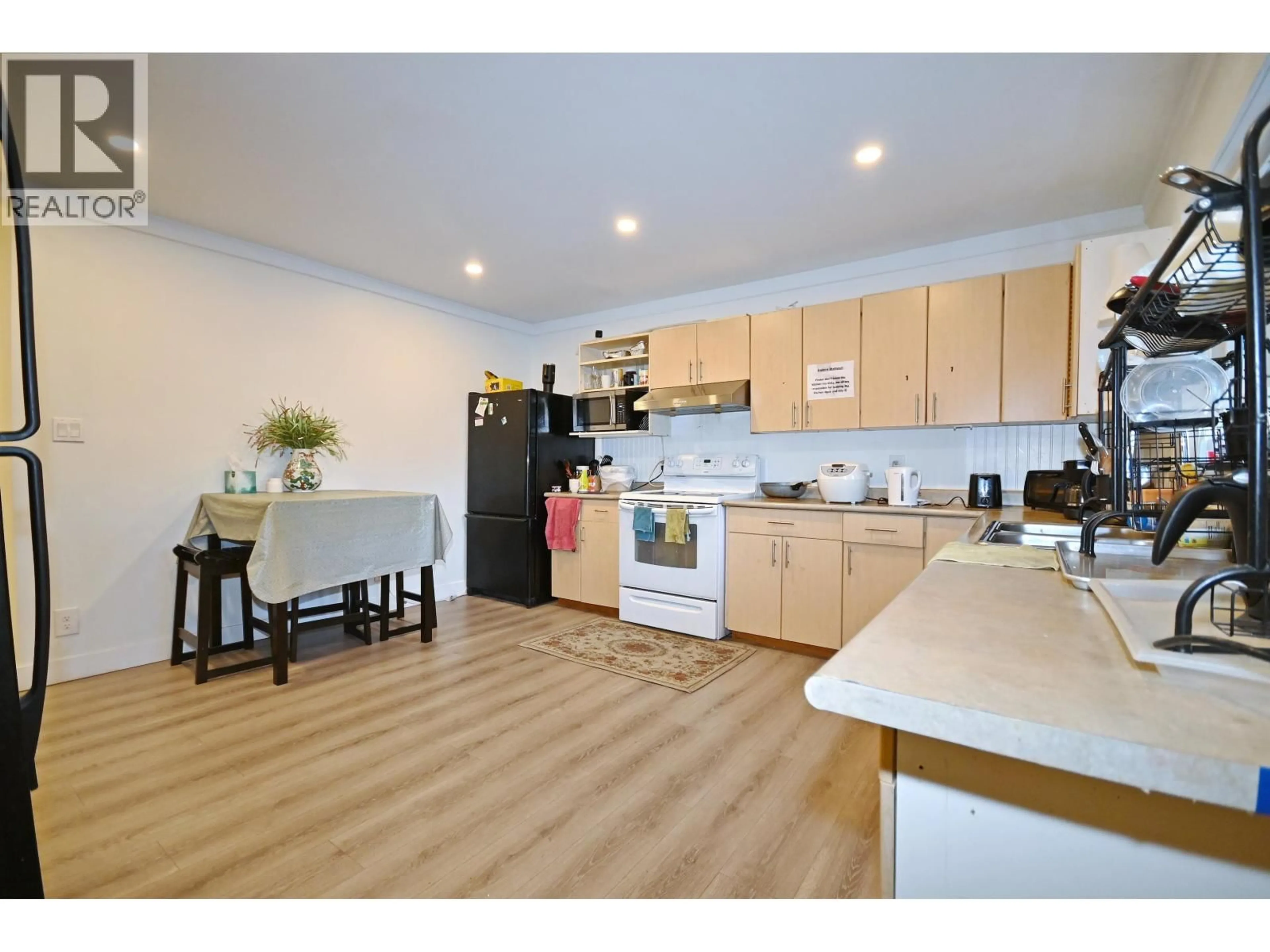 Open concept kitchen, wood/laminate floor for 7531 GILBERT ROAD, Richmond British Columbia V7C3W6
