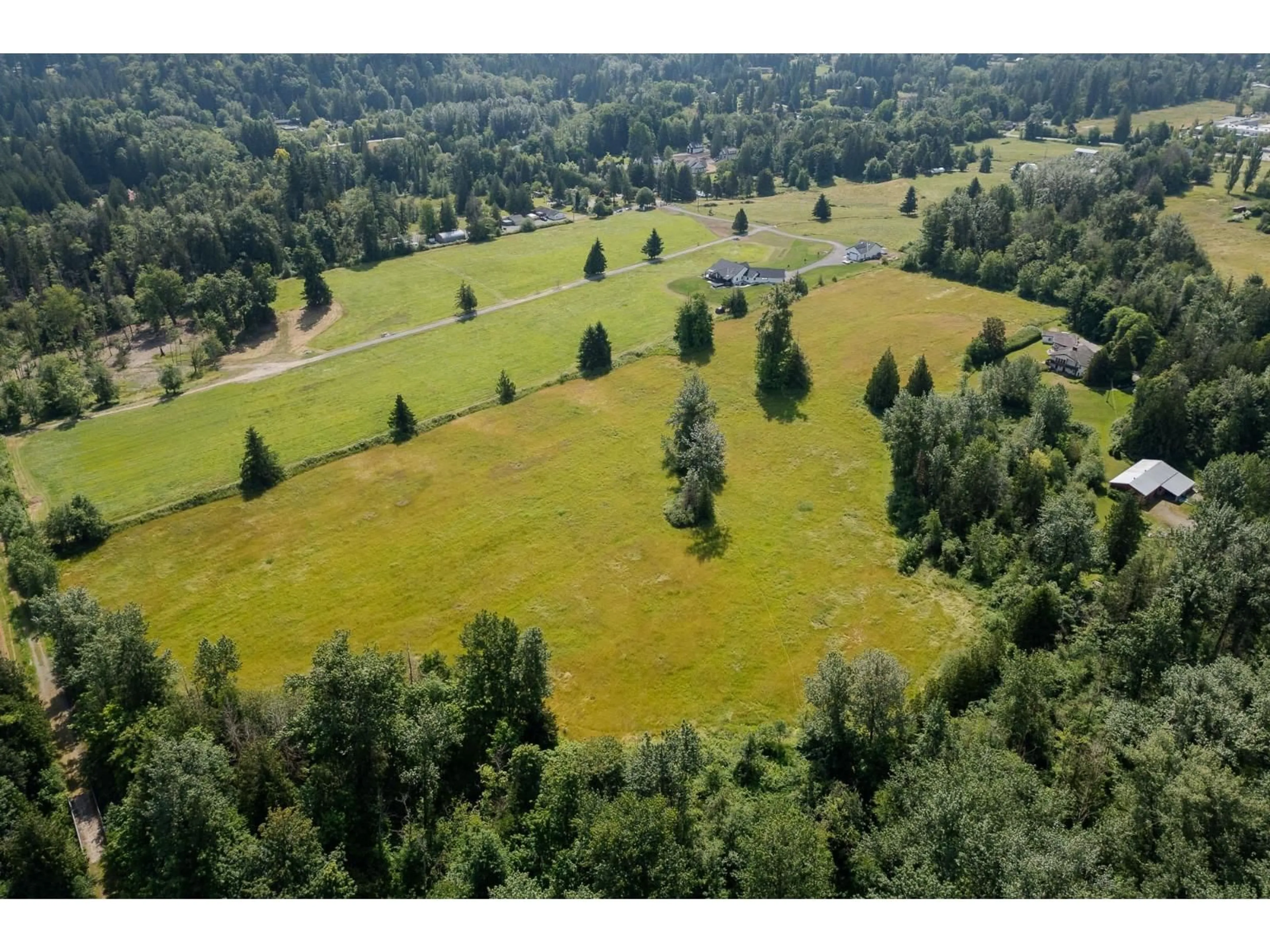 A pic from outside/outdoor area/front of a property/back of a property/a pic from drone, forest/trees view for 22801 48 AVENUE, Langley British Columbia V2Z2T7