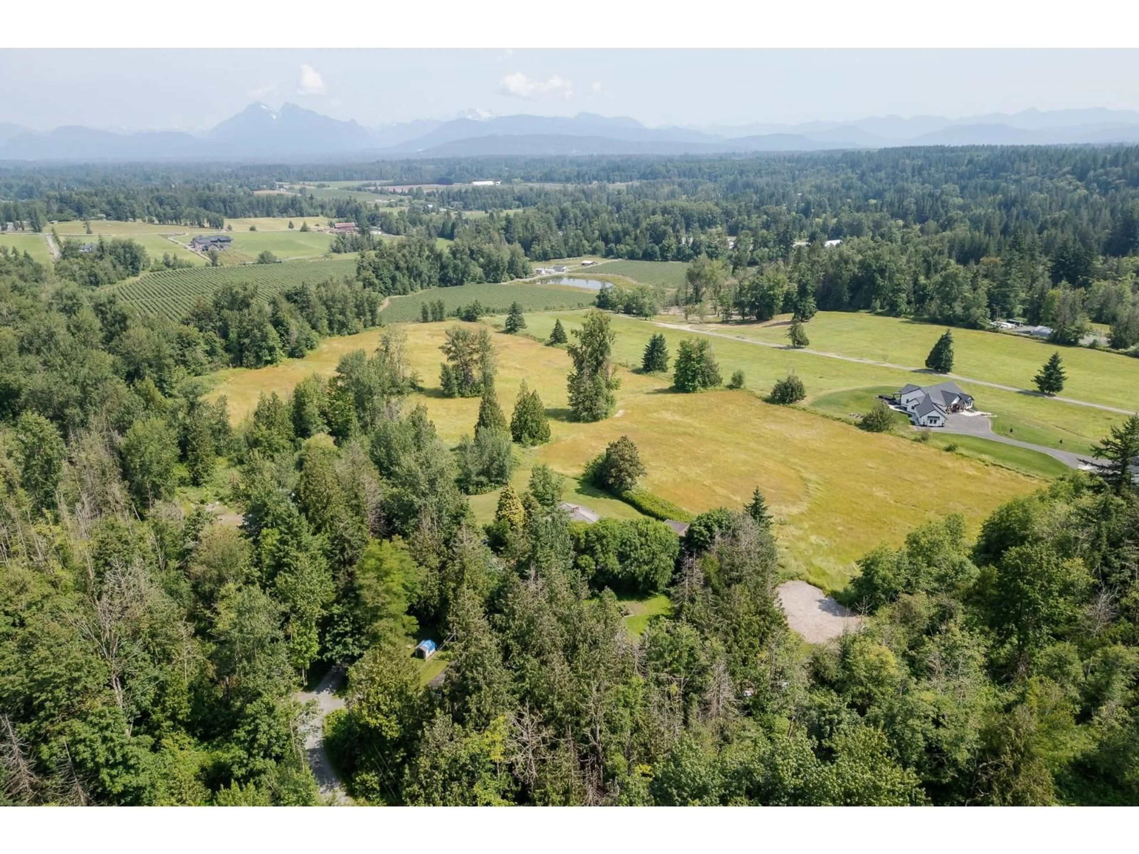A pic from outside/outdoor area/front of a property/back of a property/a pic from drone, forest/trees view for 22801 48 AVENUE, Langley British Columbia V2Z2T7