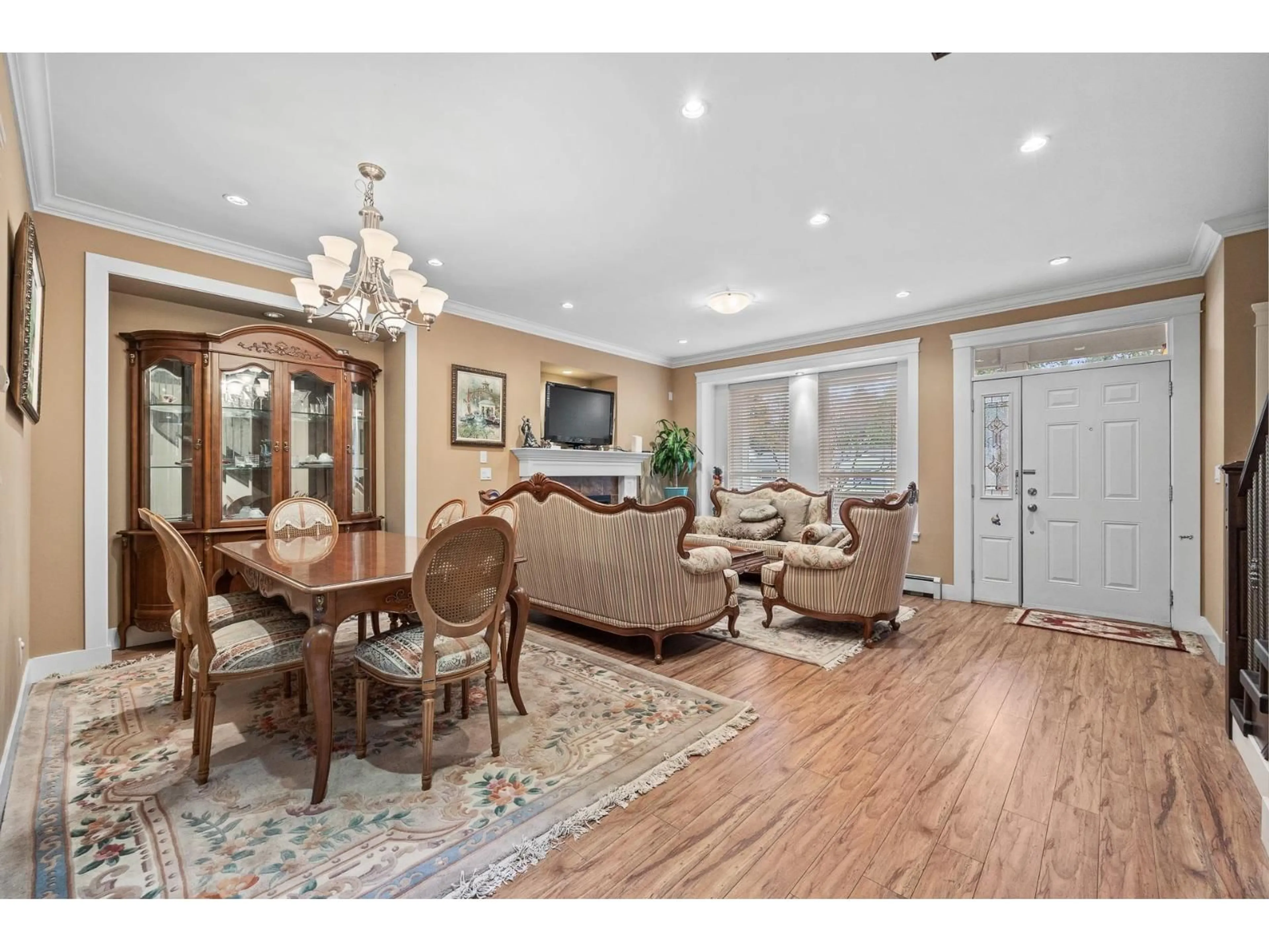 Living room with furniture, wood/laminate floor for 13145 108 AVENUE, Surrey British Columbia V3T2J2