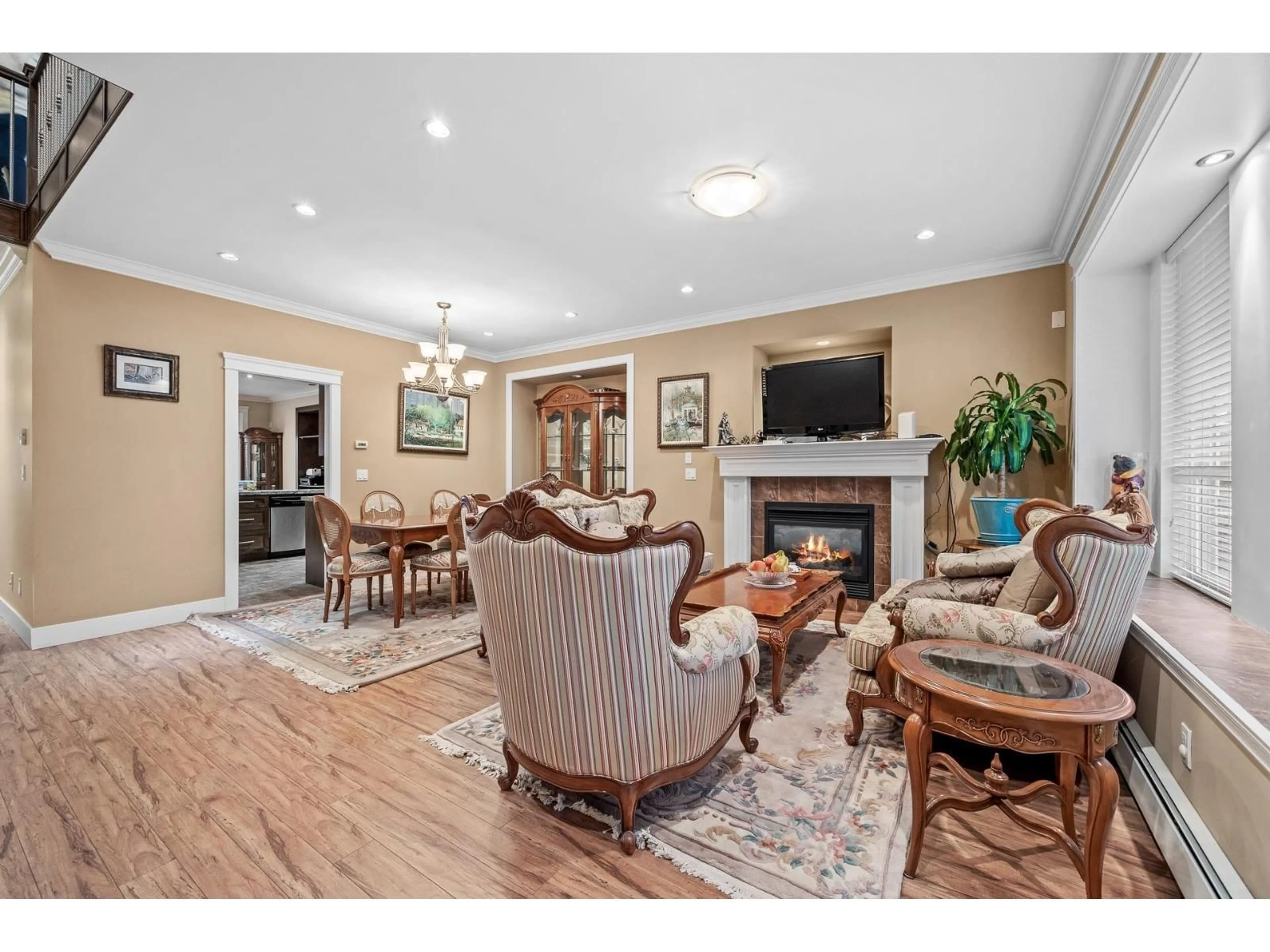 Living room with furniture, wood/laminate floor for 13145 108 AVENUE, Surrey British Columbia V3T2J2