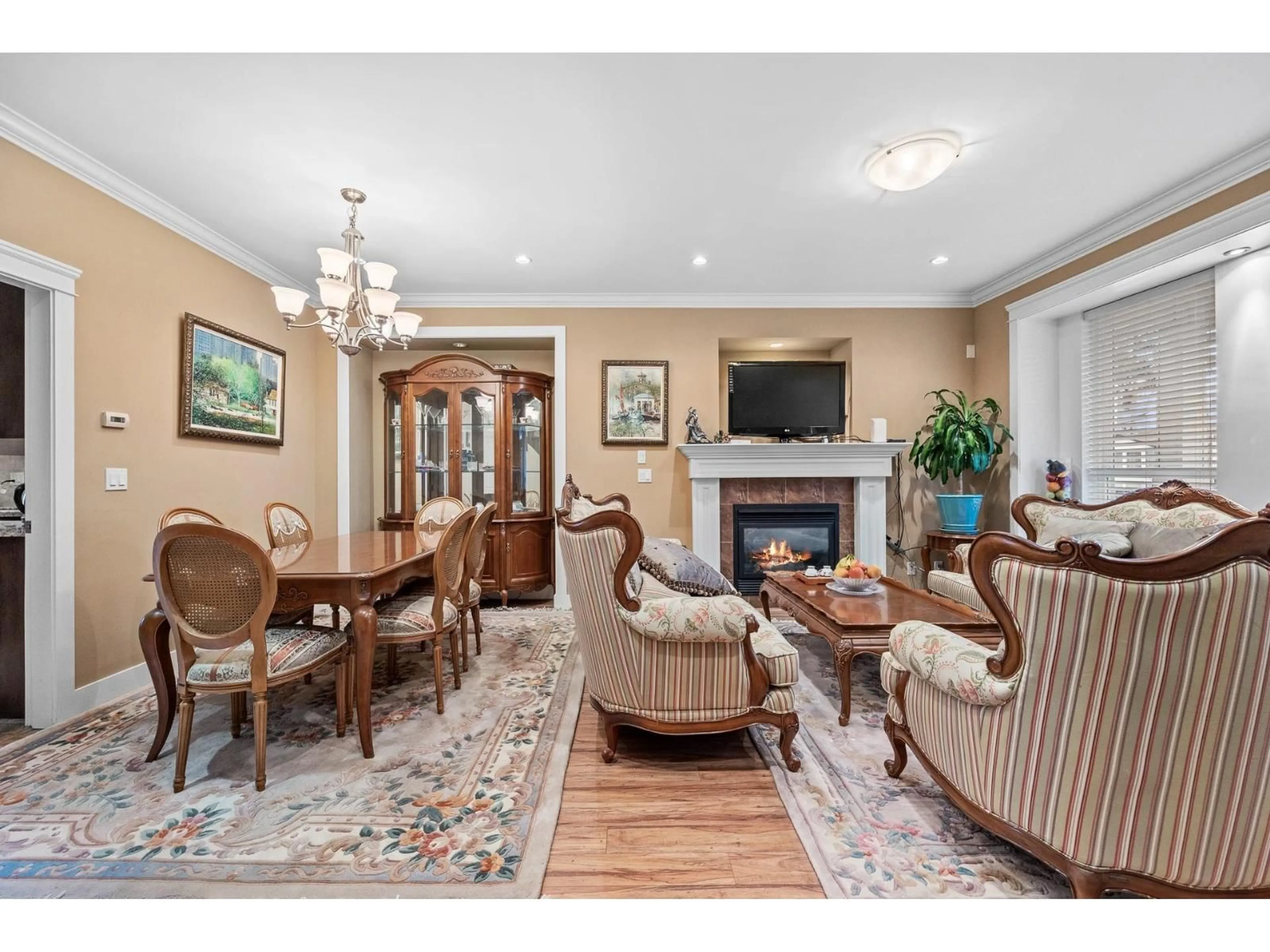 Living room with furniture, wood/laminate floor for 13145 108 AVENUE, Surrey British Columbia V3T2J2