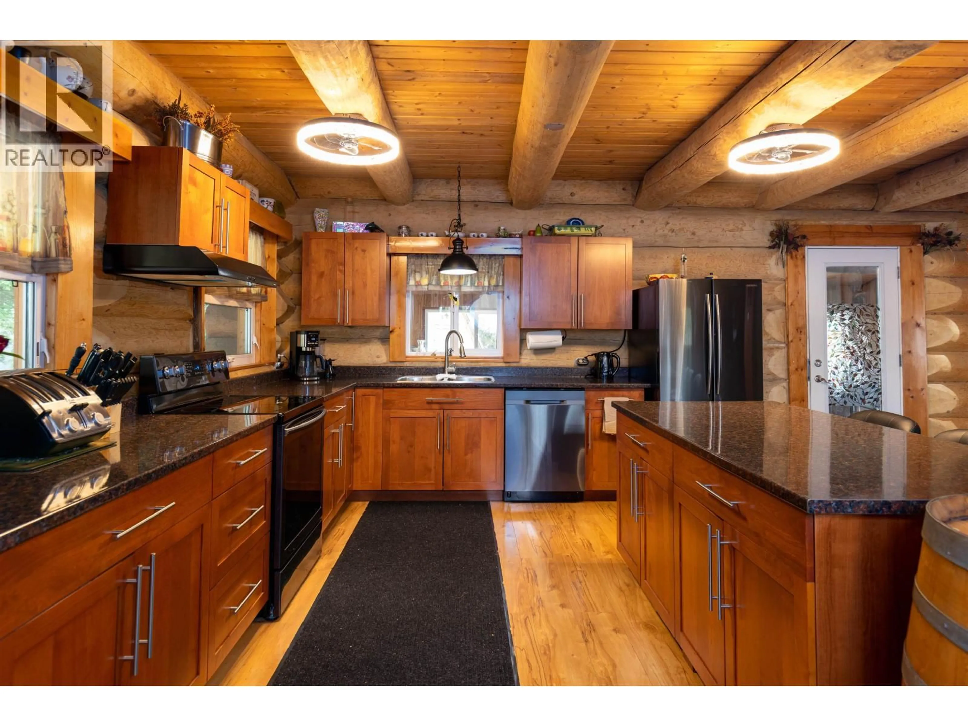 Open concept kitchen, wood/laminate floor for 3981 DOBBIE STREET, Terrace British Columbia V8G3M6