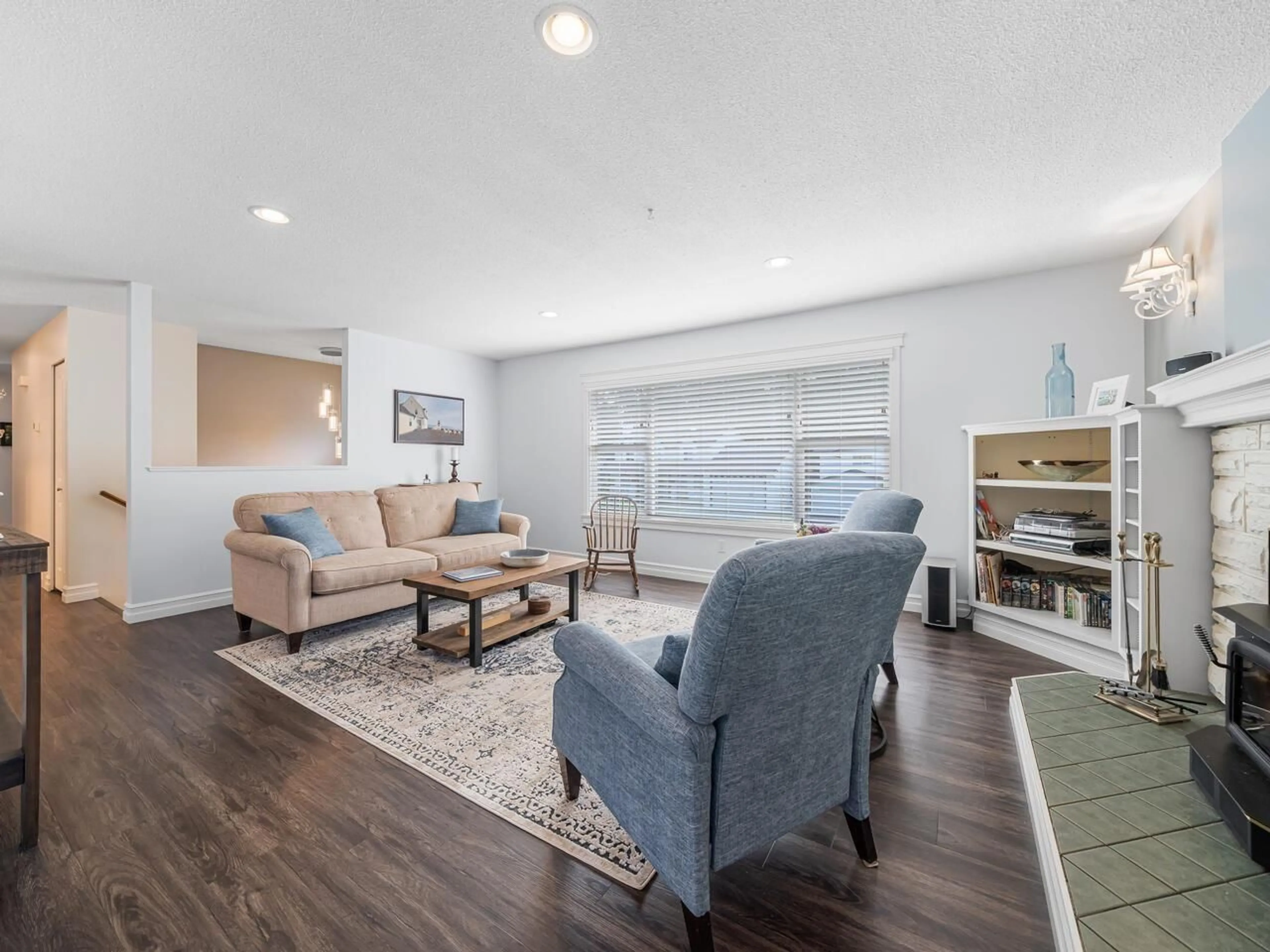 Living room with furniture, wood/laminate floor for 4551 209 STREET, Langley British Columbia V3A2K7
