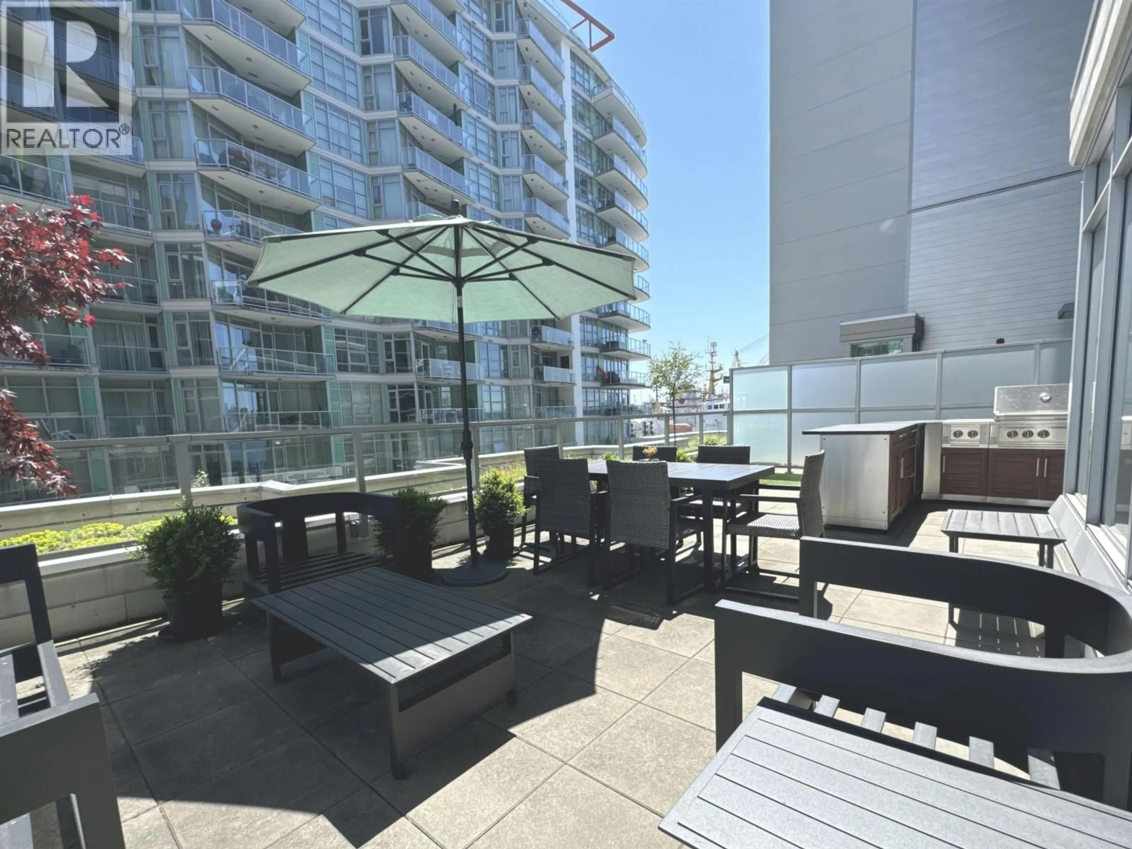 Patio, water/lake/river/ocean view for 202 - 185 VICTORY SHIP WAY, North Vancouver British Columbia V7L0G2