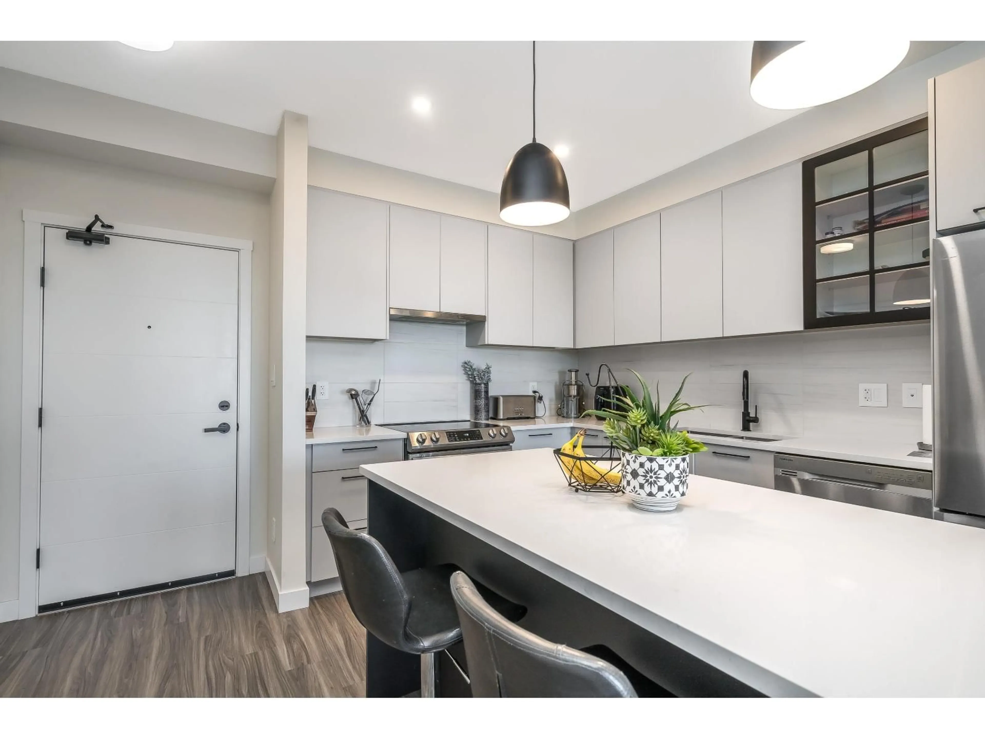 Open concept kitchen, unknown for 411 - 8117 200A STREET, Langley British Columbia V2Y3W9