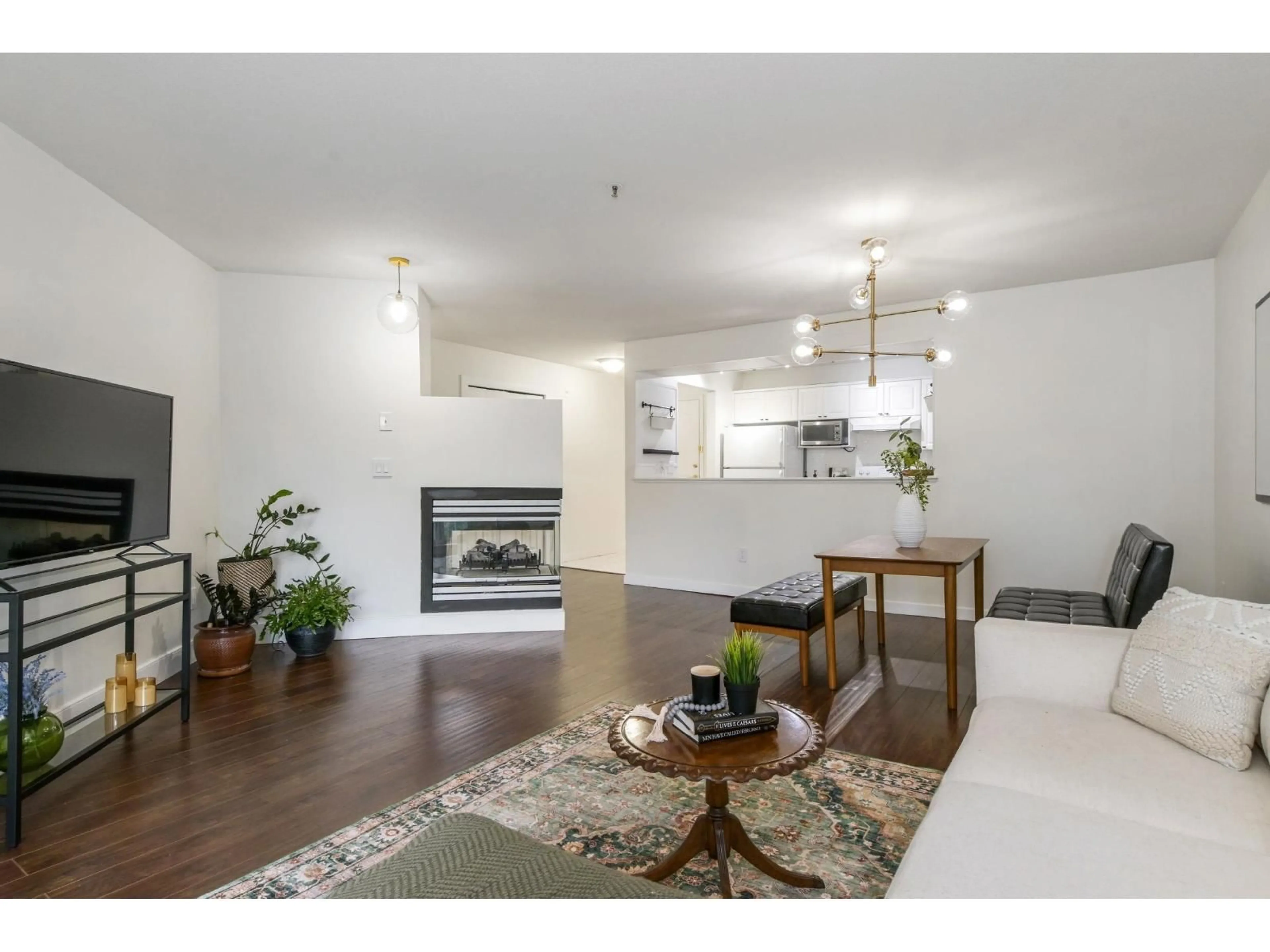 Living room with furniture, wood/laminate floor for 401 - 5465 201 STREET, Langley British Columbia V3A1P8