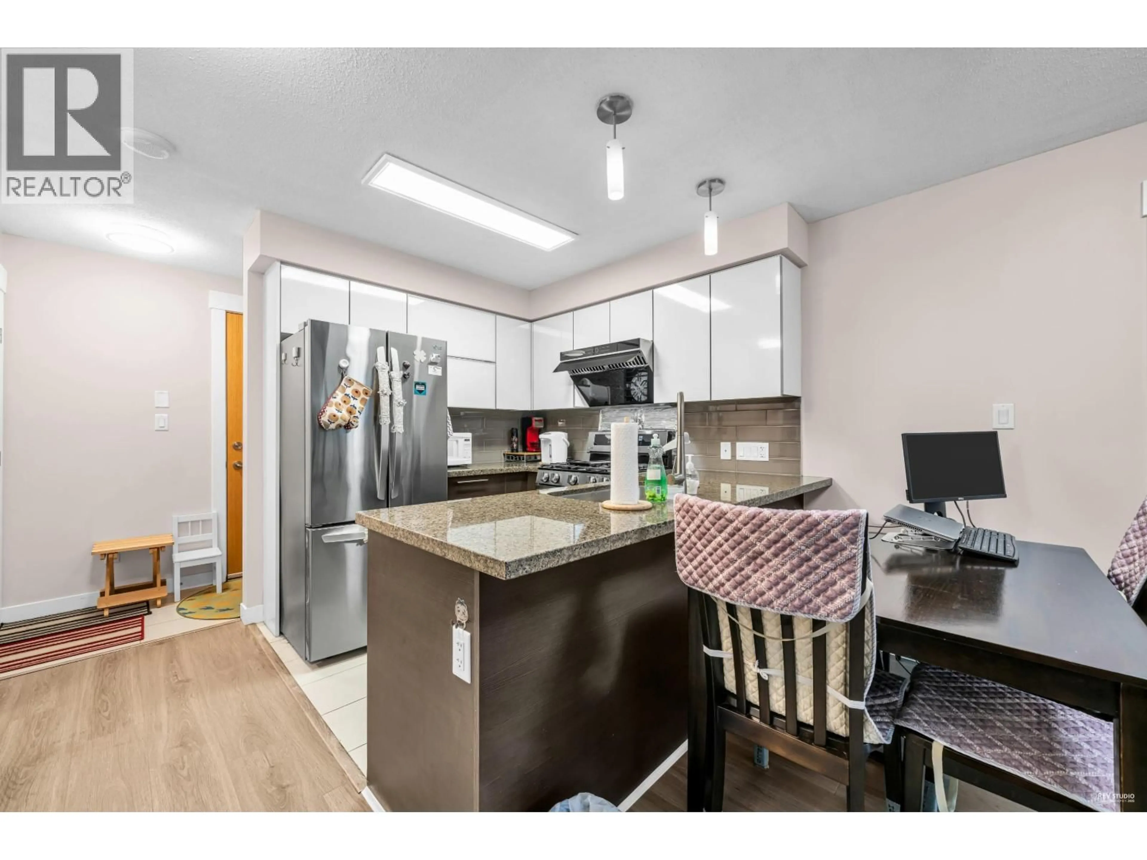 Open concept kitchen, wood/laminate floor for 509 - 6733 BUSWELL STREET, Richmond British Columbia V6Y0E3
