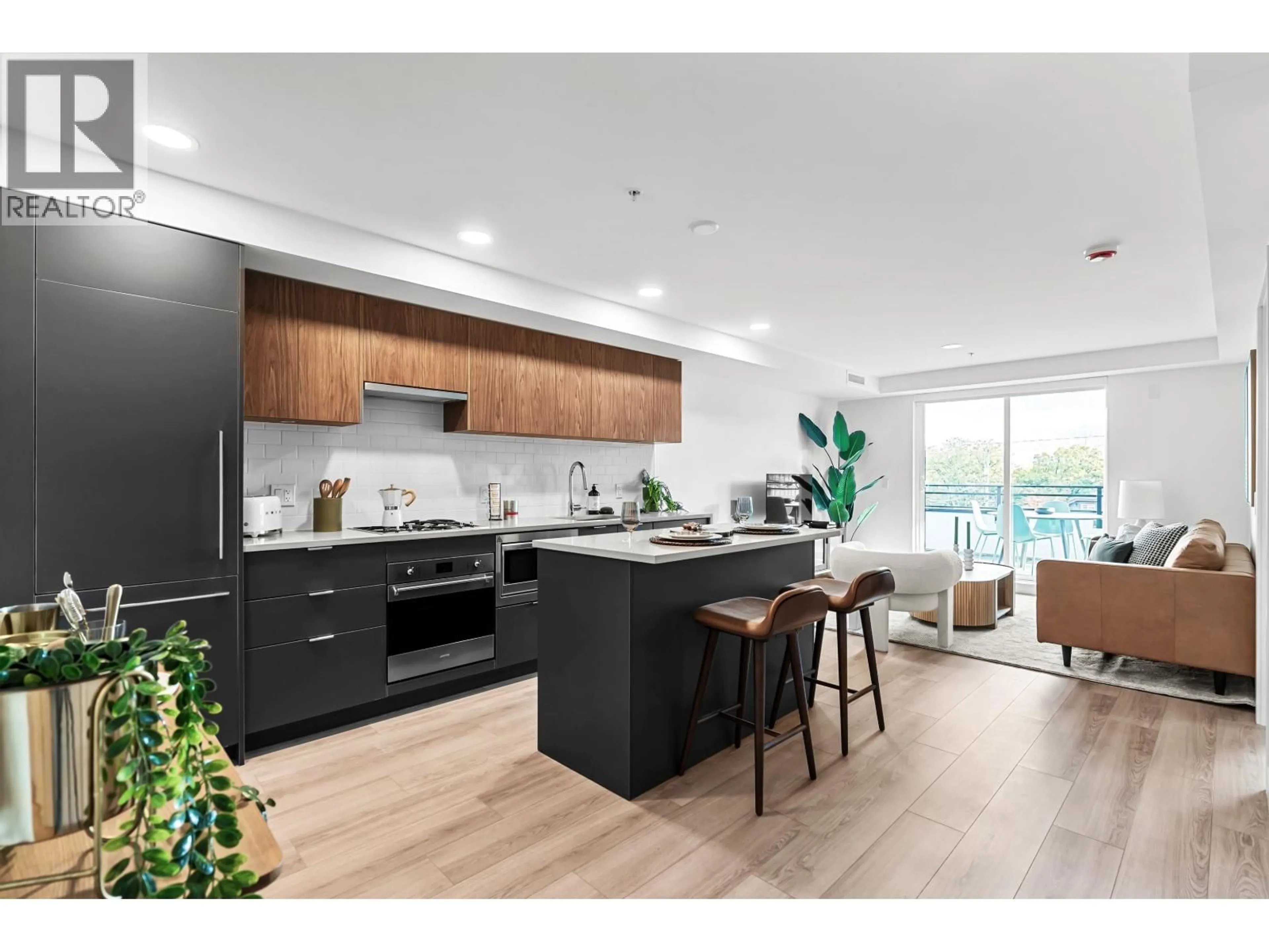 Open concept kitchen, wood/laminate floor for 307 - 2419 GRANT STREET, Vancouver British Columbia V5K3G5
