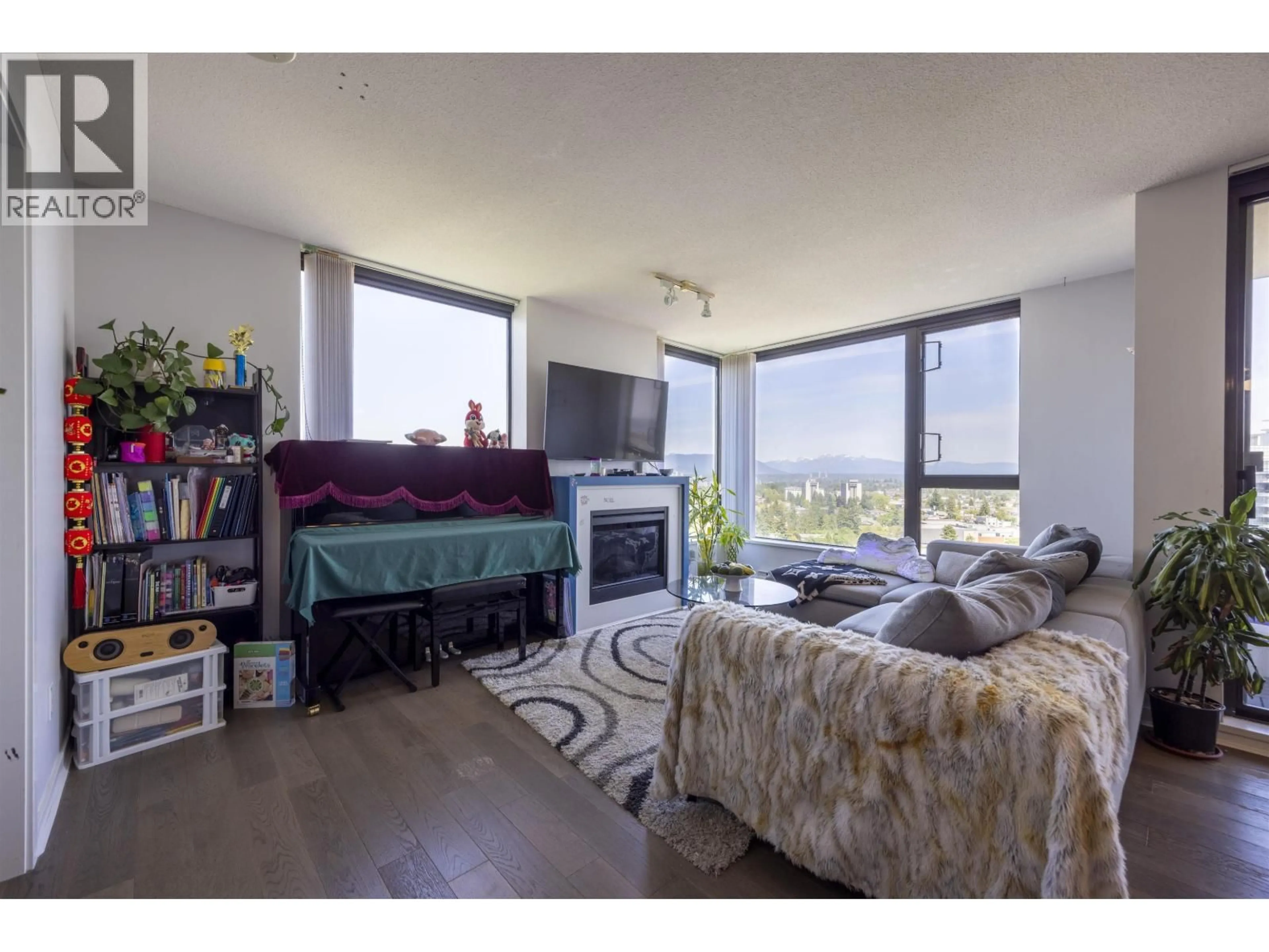 Living room with furniture, wood/laminate floor for 2103 - 7063 HALL AVENUE, Burnaby British Columbia V5E0A5