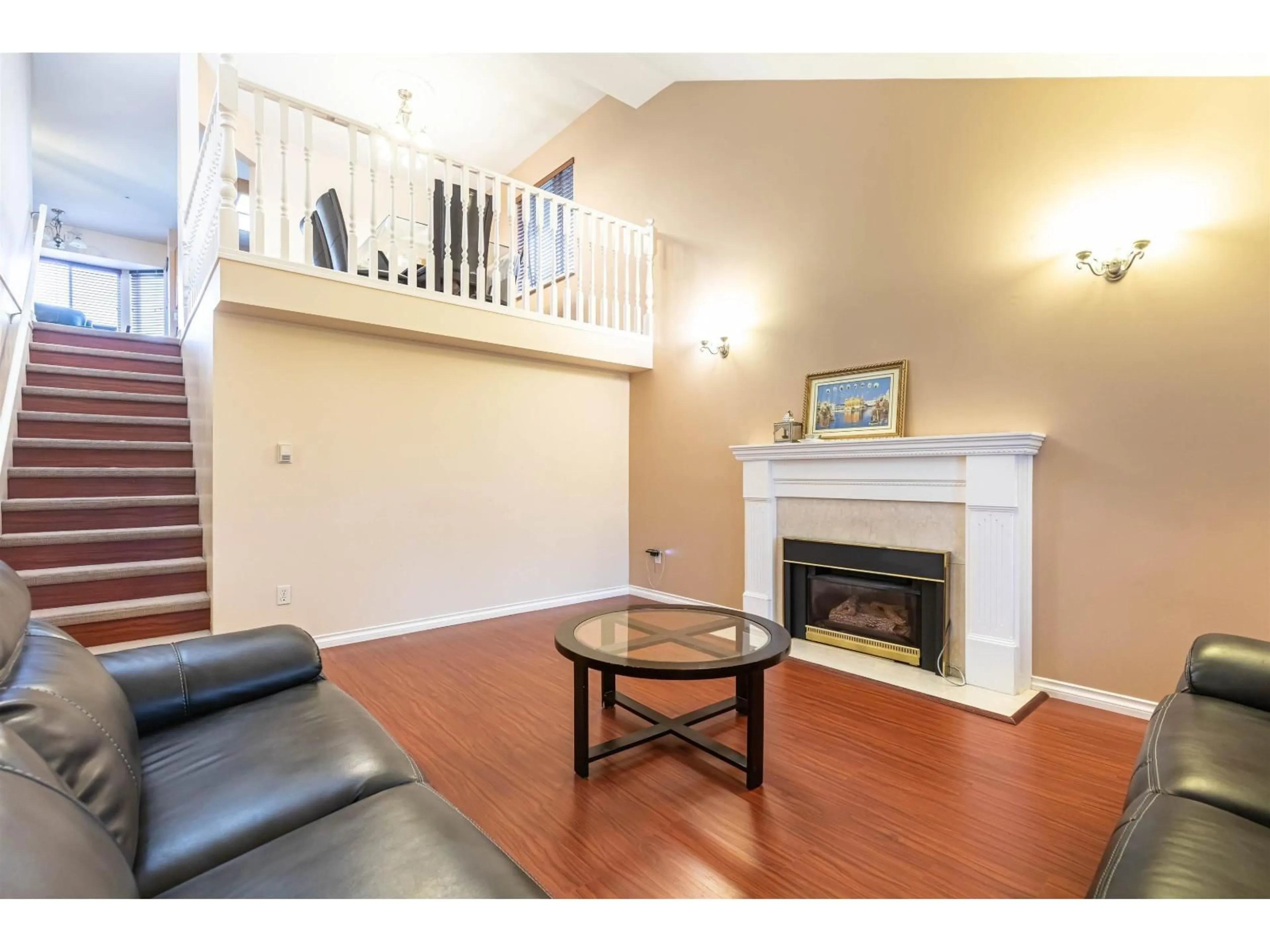 Living room with furniture, wood/laminate floor for 14312 69A STREET, Surrey British Columbia V3W0E2