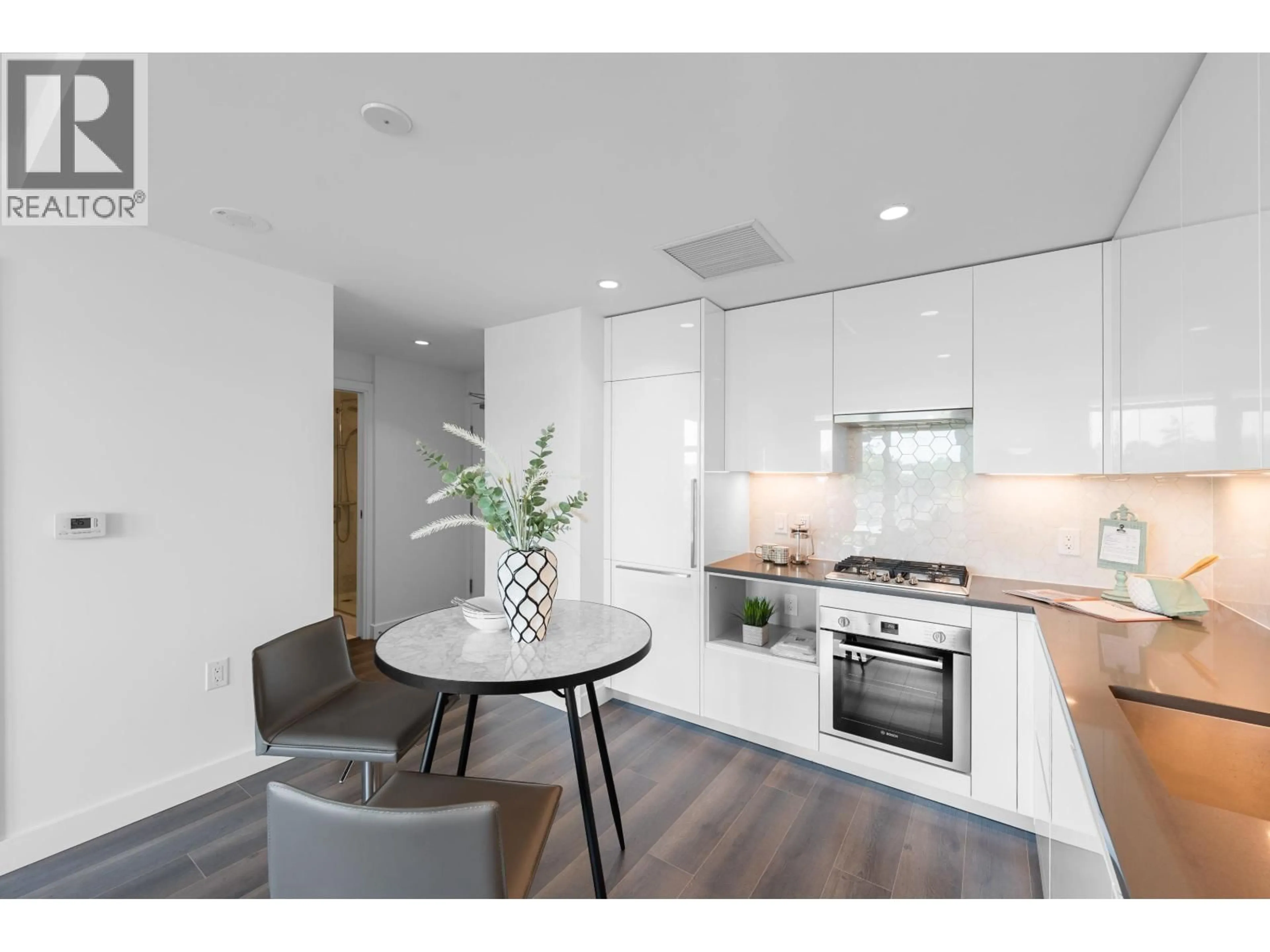 Open concept kitchen, wood/laminate floor for 405 - 8181 CHESTER STREET, Vancouver British Columbia V5X0J9