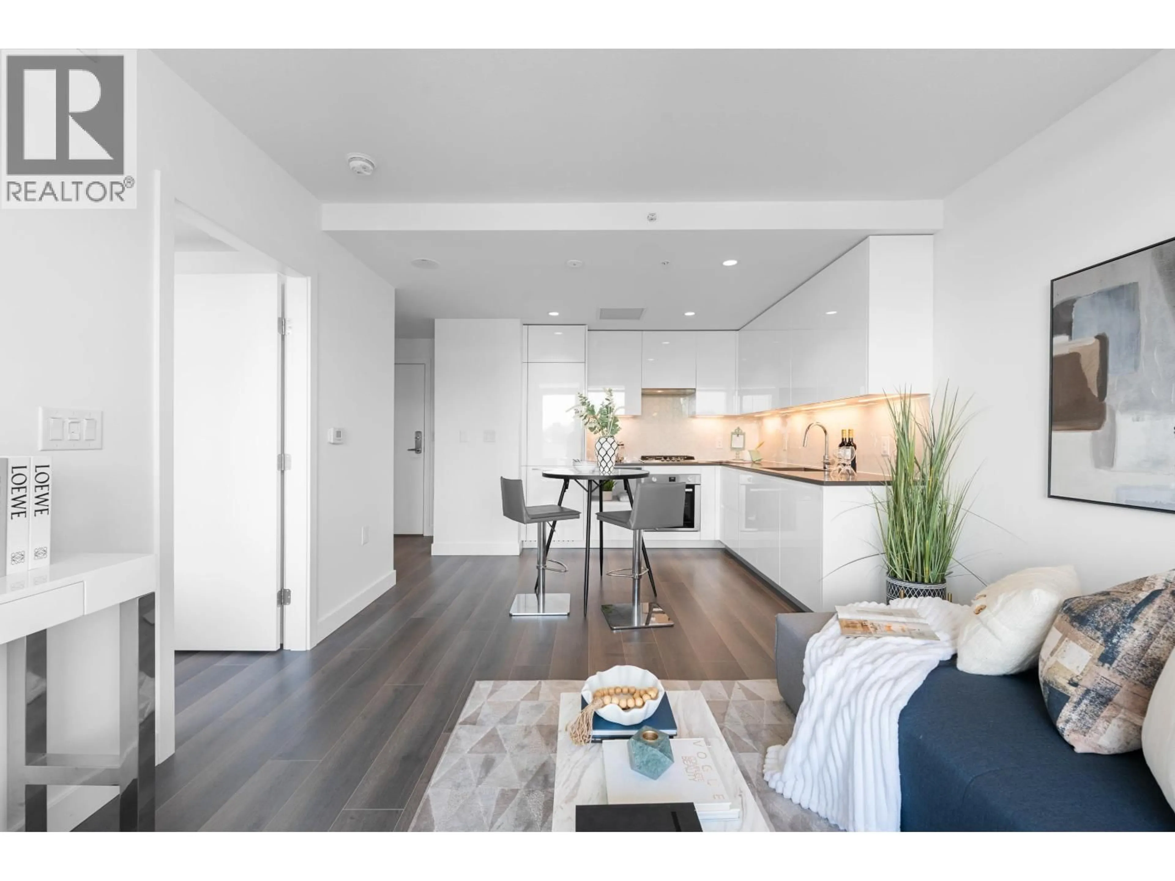 Open concept kitchen, wood/laminate floor for 405 - 8181 CHESTER STREET, Vancouver British Columbia V5X0J9