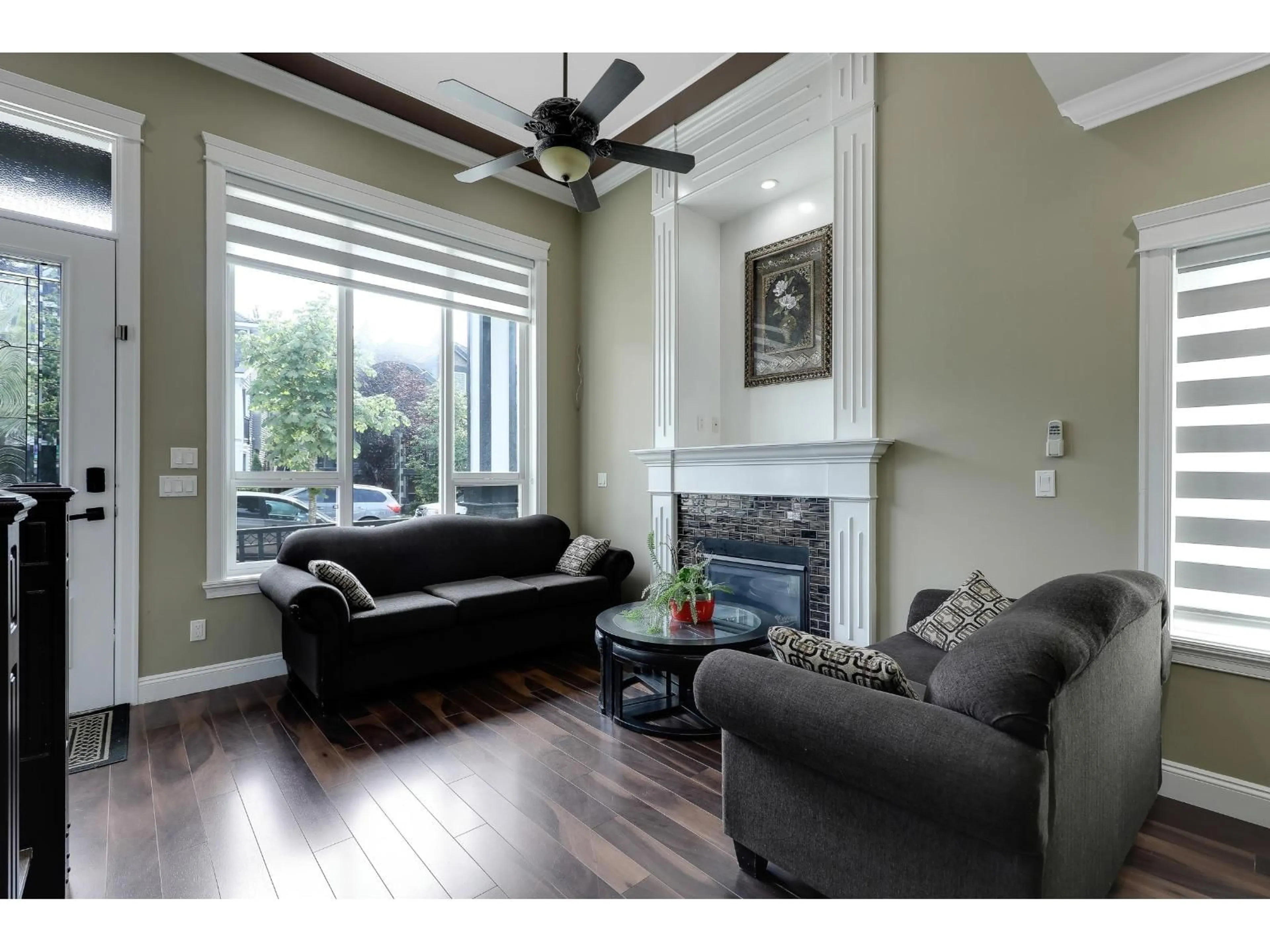 Living room with furniture, wood/laminate floor for 14881 63 AVENUE, Surrey British Columbia V3S2W9