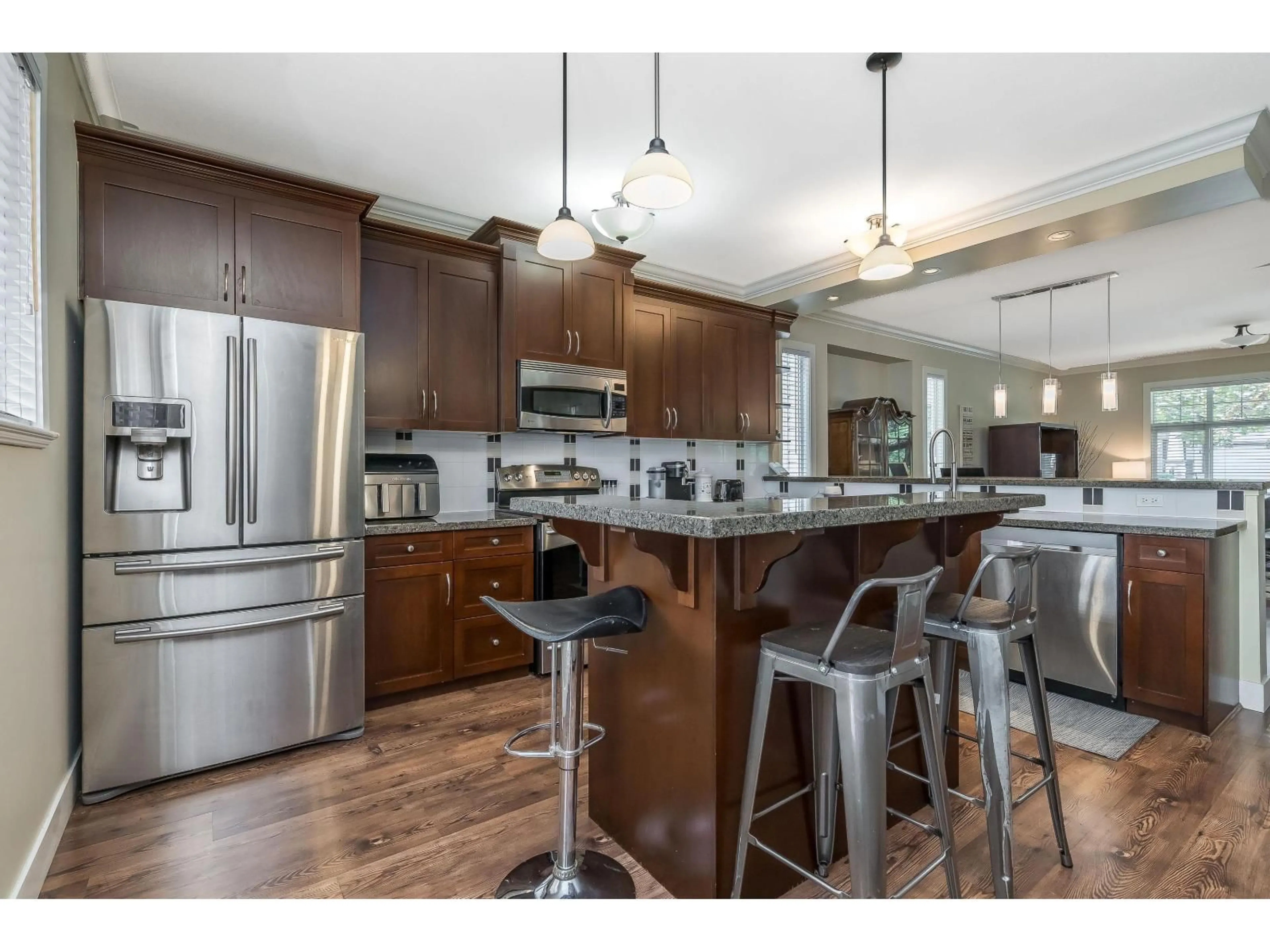 Open concept kitchen, wood/laminate floor for 19232 68A AVENUE, Surrey British Columbia V4N0B6