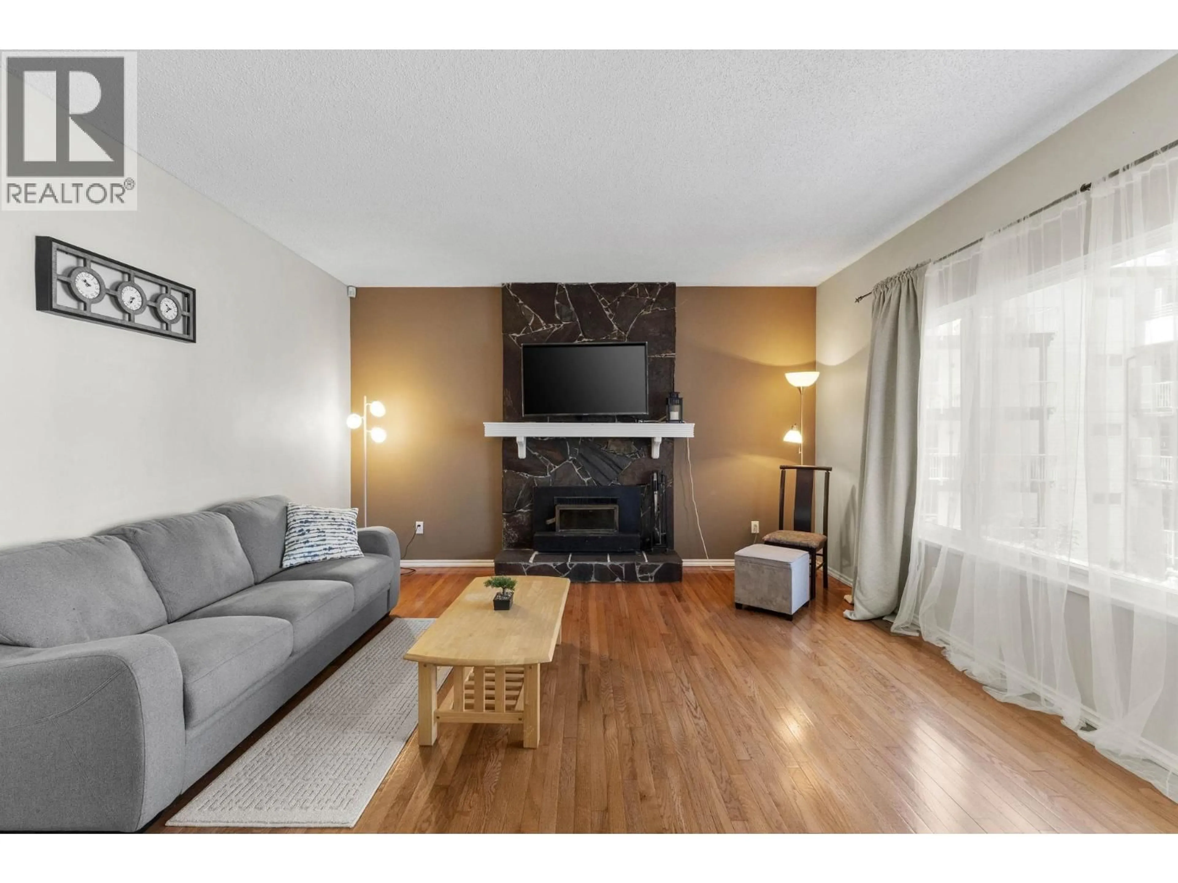 Living room with furniture, wood/laminate floor for 171 EDWARD CRESCENT, Port Moody British Columbia V3H3J8