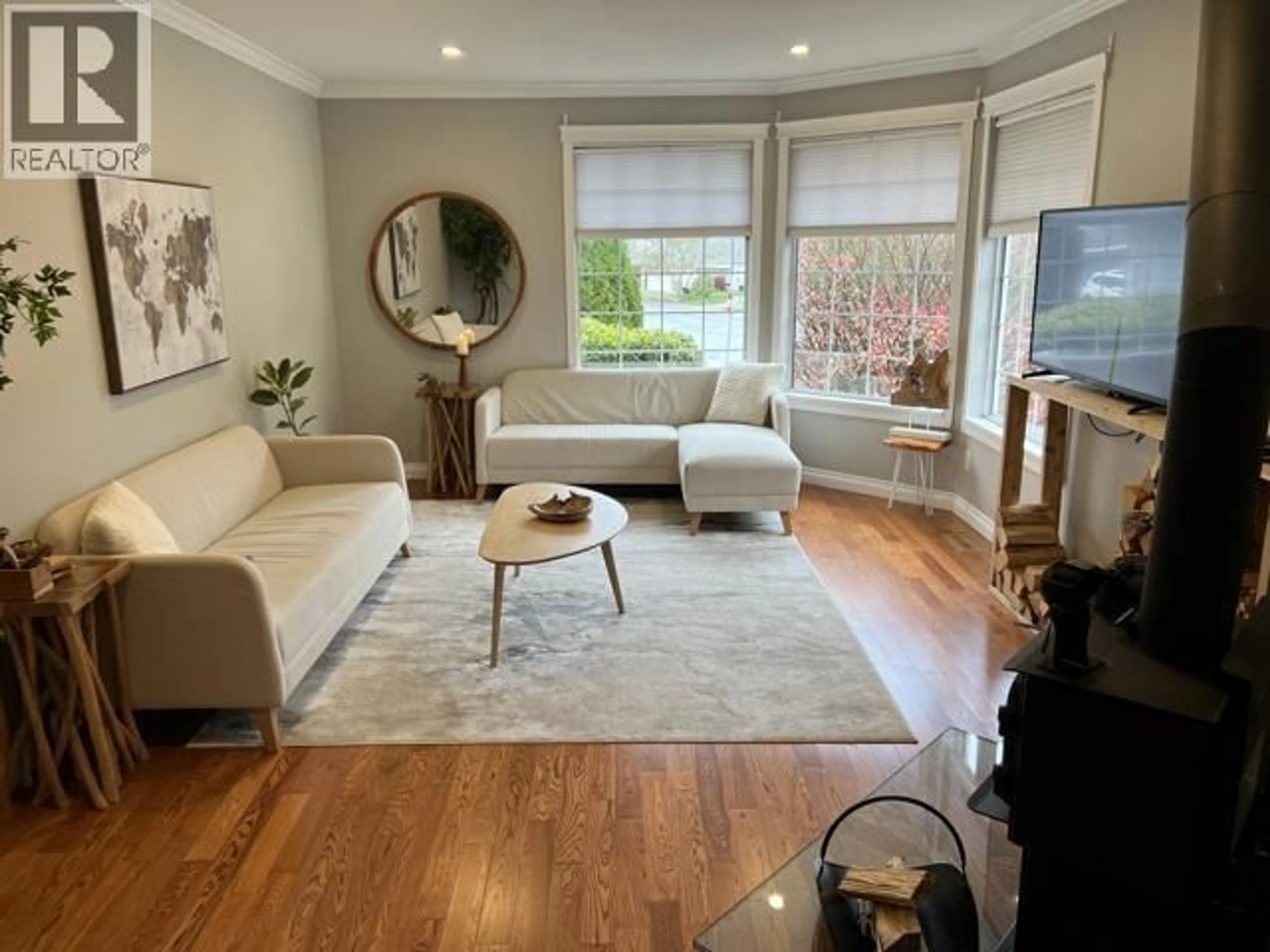 Living room with furniture, wood/laminate floor for 23390 123 AVENUE, Maple Ridge British Columbia V2X0P7
