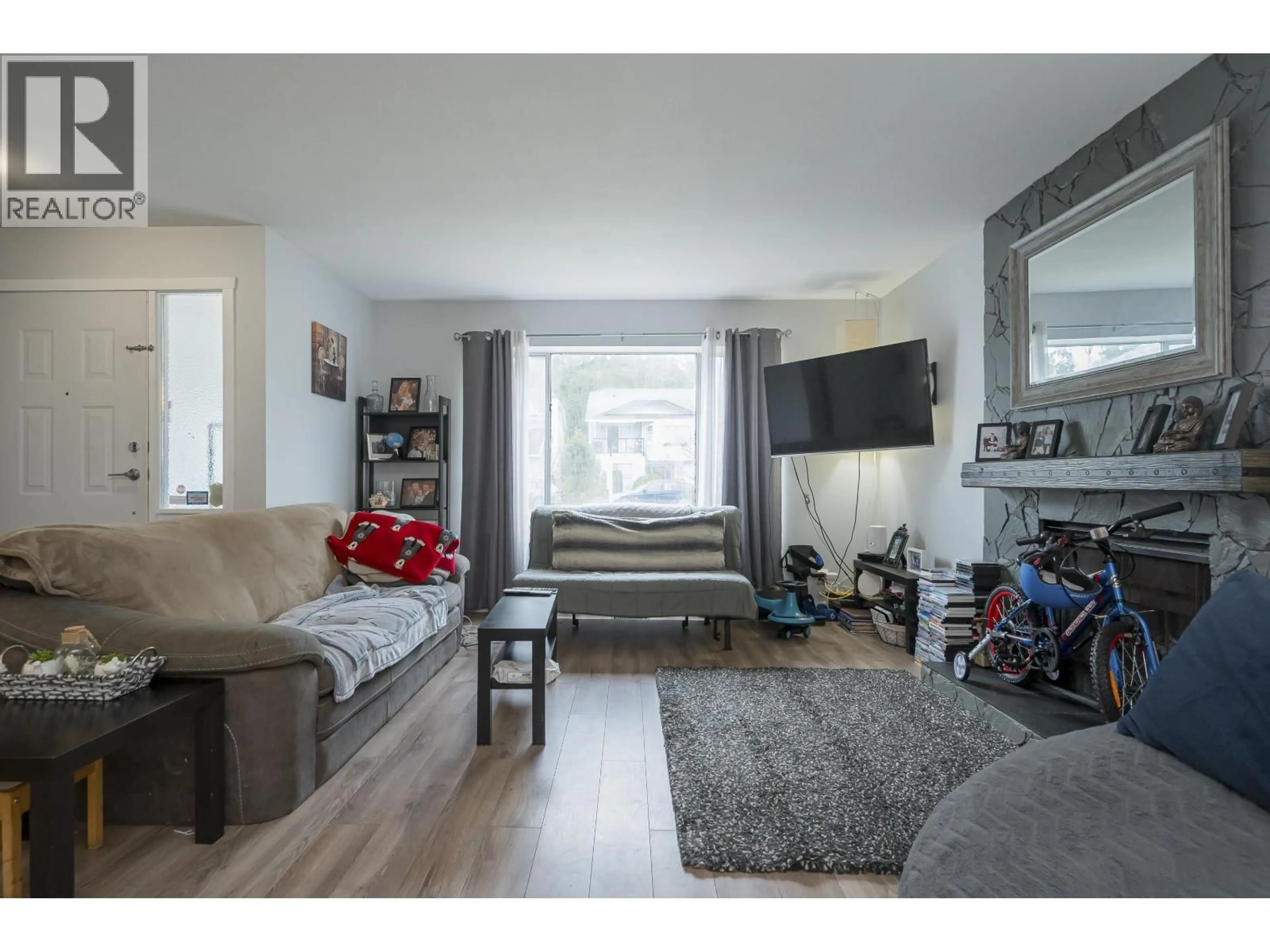 Living room with furniture, wood/laminate floor for 12145 207A STREET, Maple Ridge British Columbia V7M1W4