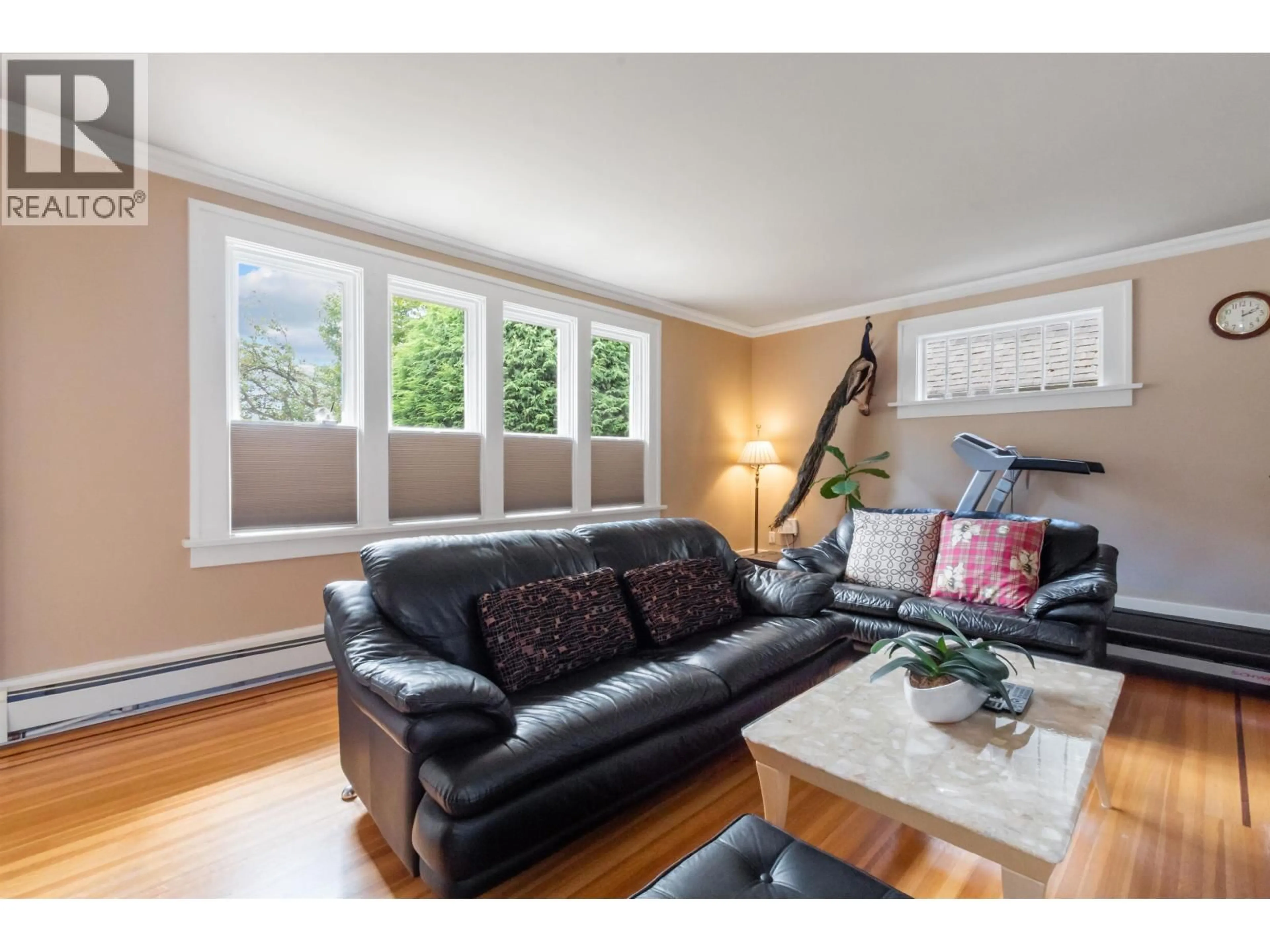 Living room with furniture, wood/laminate floor for 1945 45TH AVENUE, Vancouver British Columbia V6M2H7