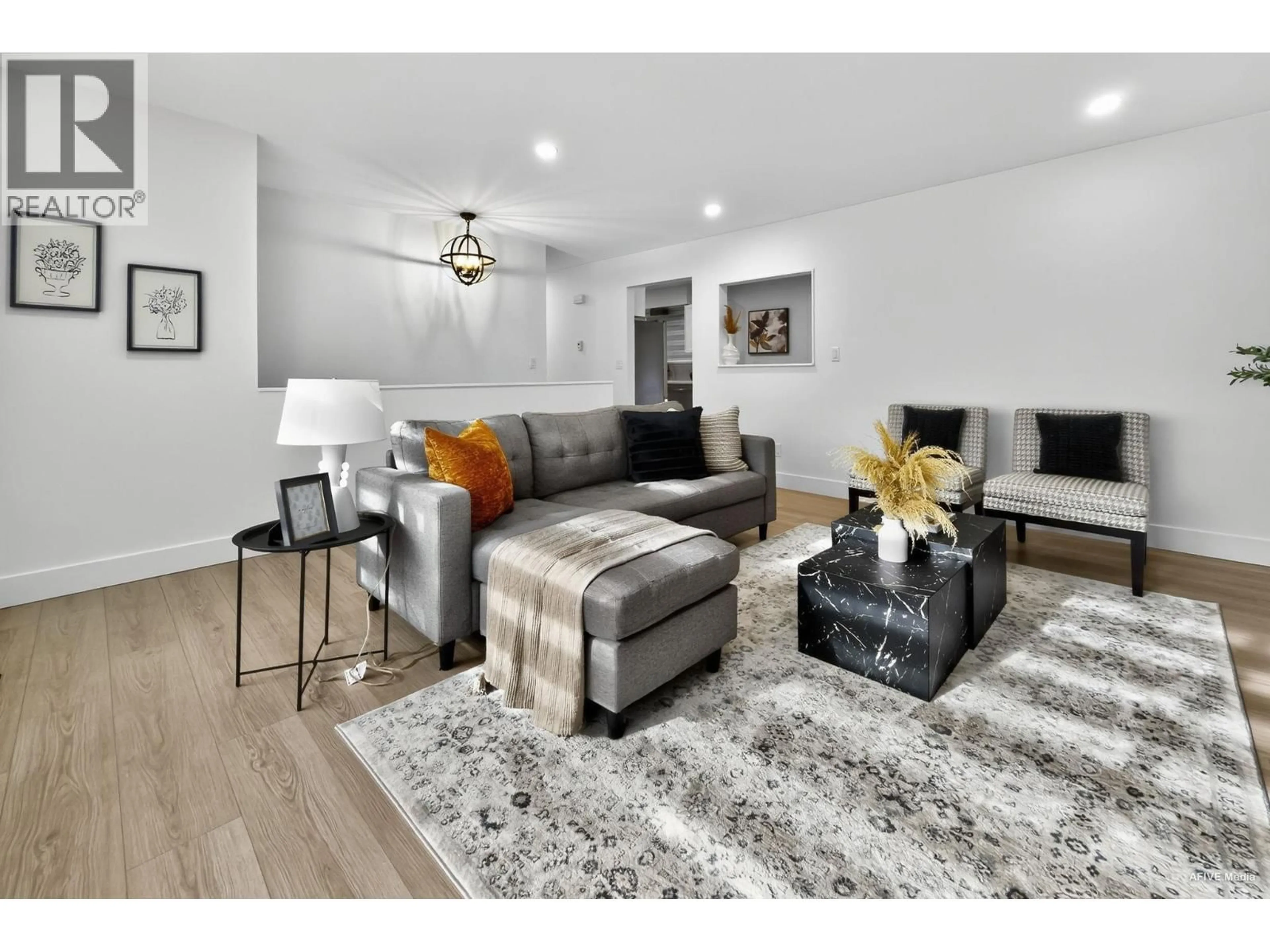 Living room with furniture, wood/laminate floor for 9831 GLENTHORNE DRIVE, Richmond British Columbia V7A1Y3