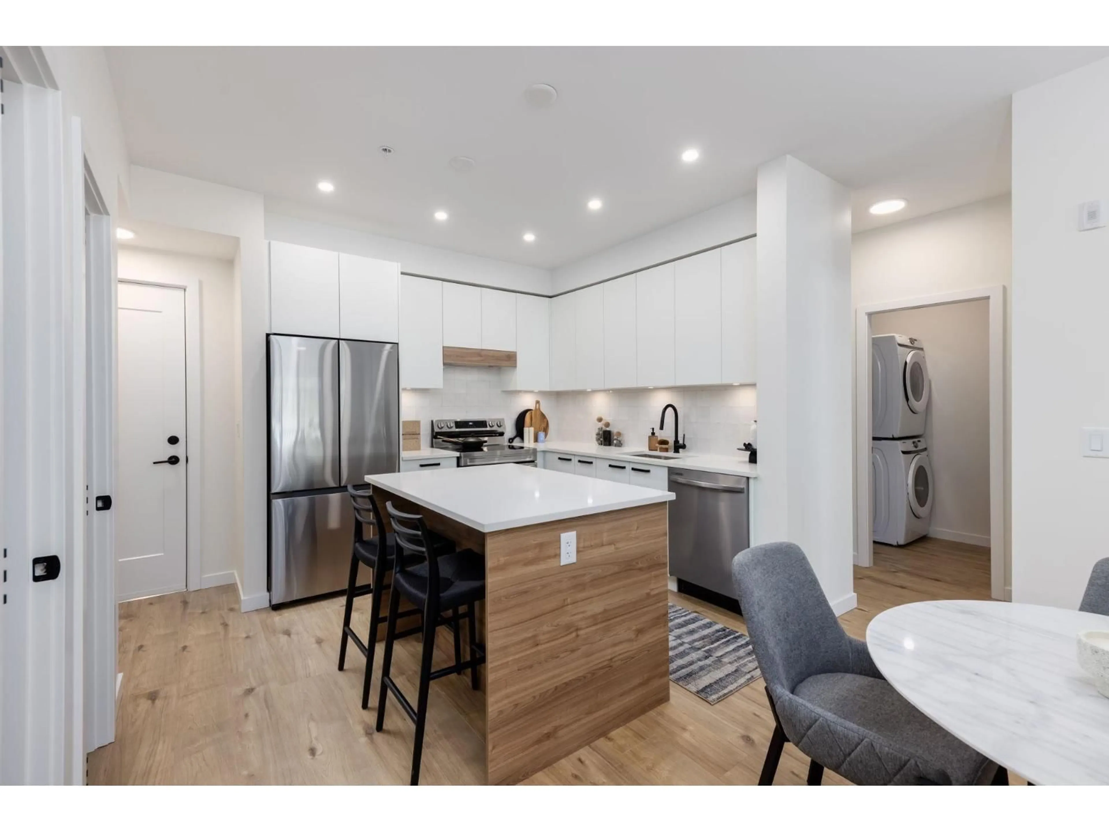 Open concept kitchen, wood/laminate floor for 409 - 33920 BEST AVENUE, Mission British Columbia V2V0L9