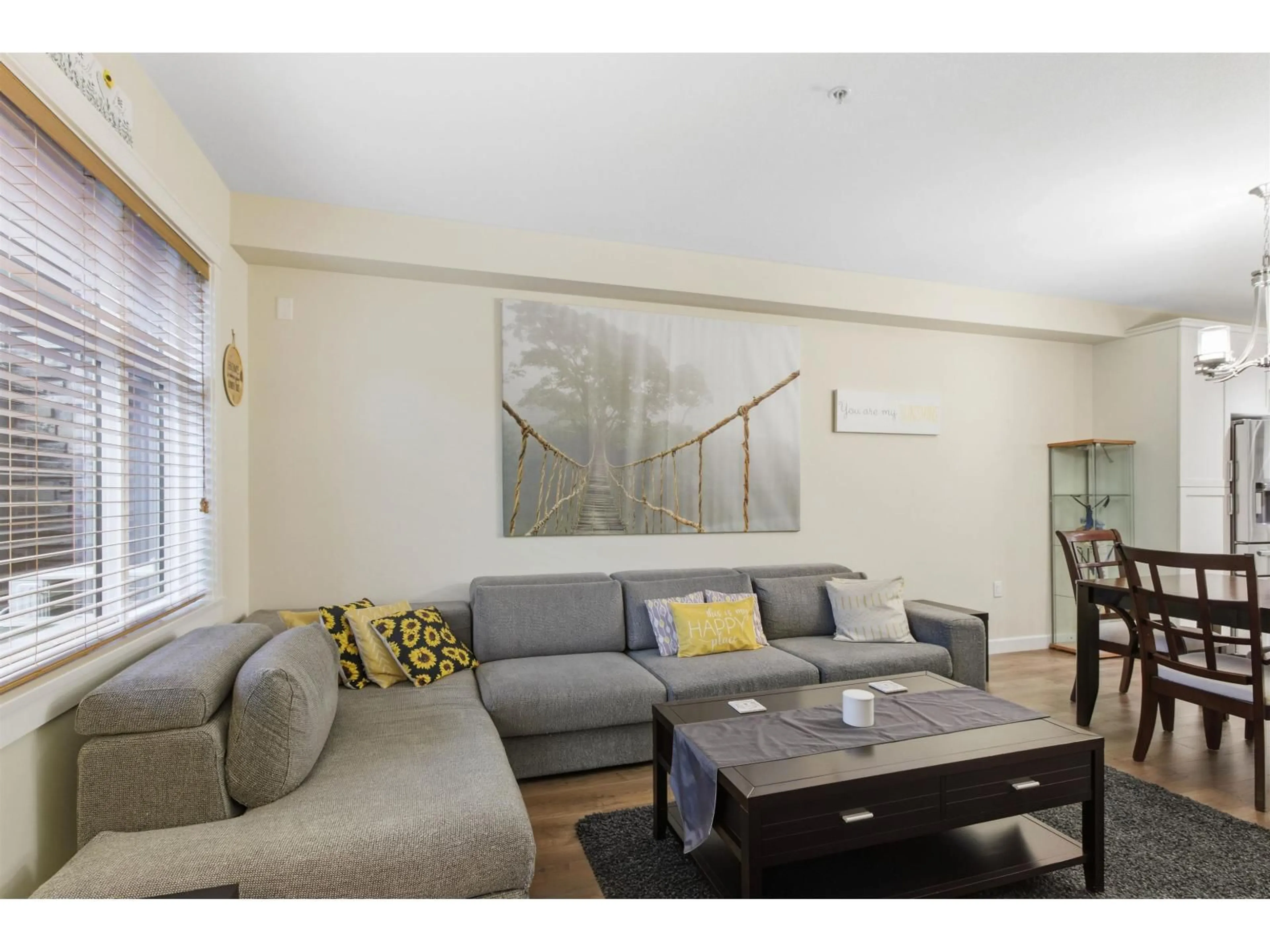 Living room with furniture, wood/laminate floor for 109 - 8526 202B STREET, Langley British Columbia V2Y3L3