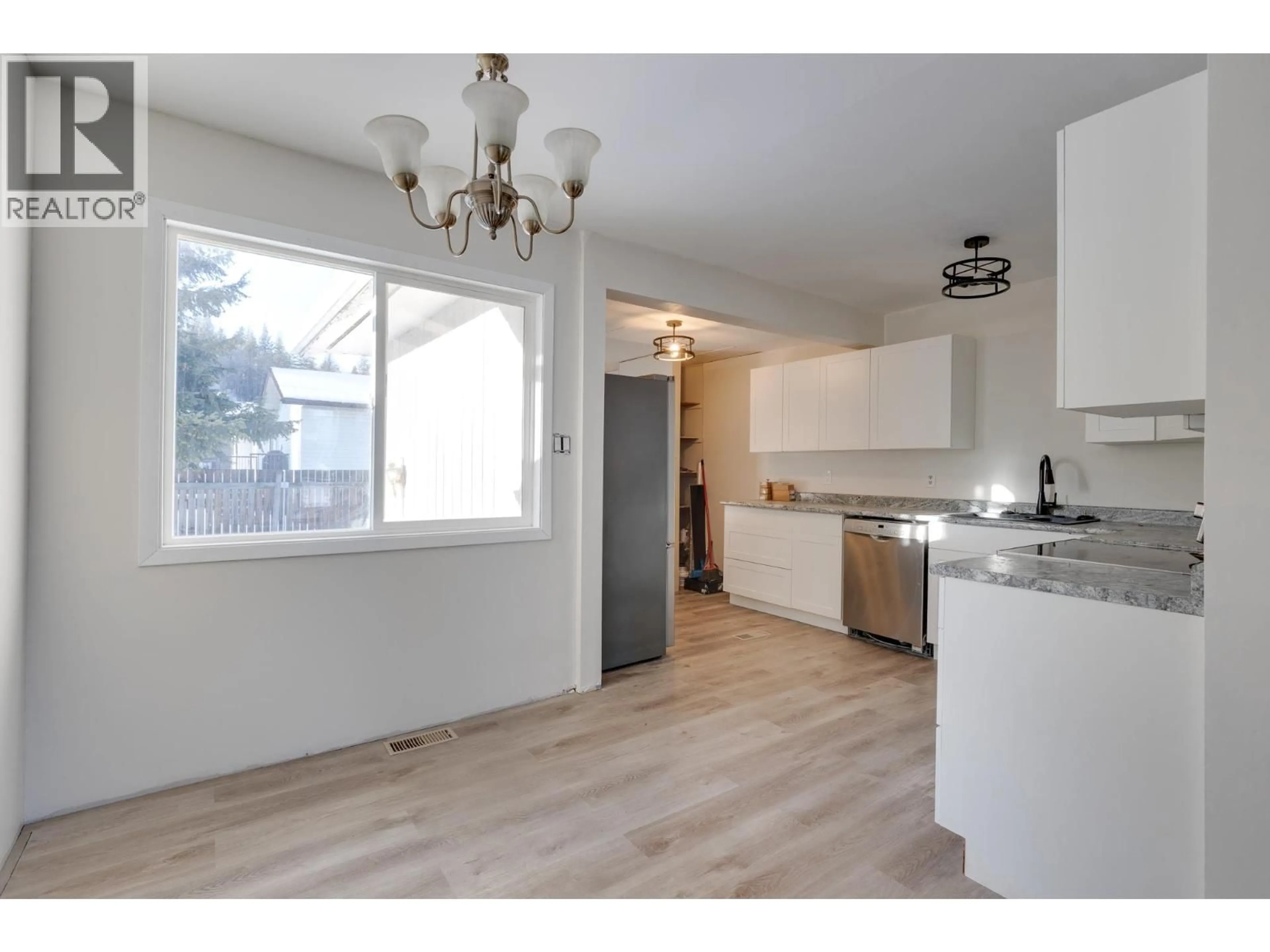 Open concept kitchen, wood/laminate floor for 4051 DAVIS ROAD, Prince George British Columbia V2N5K9