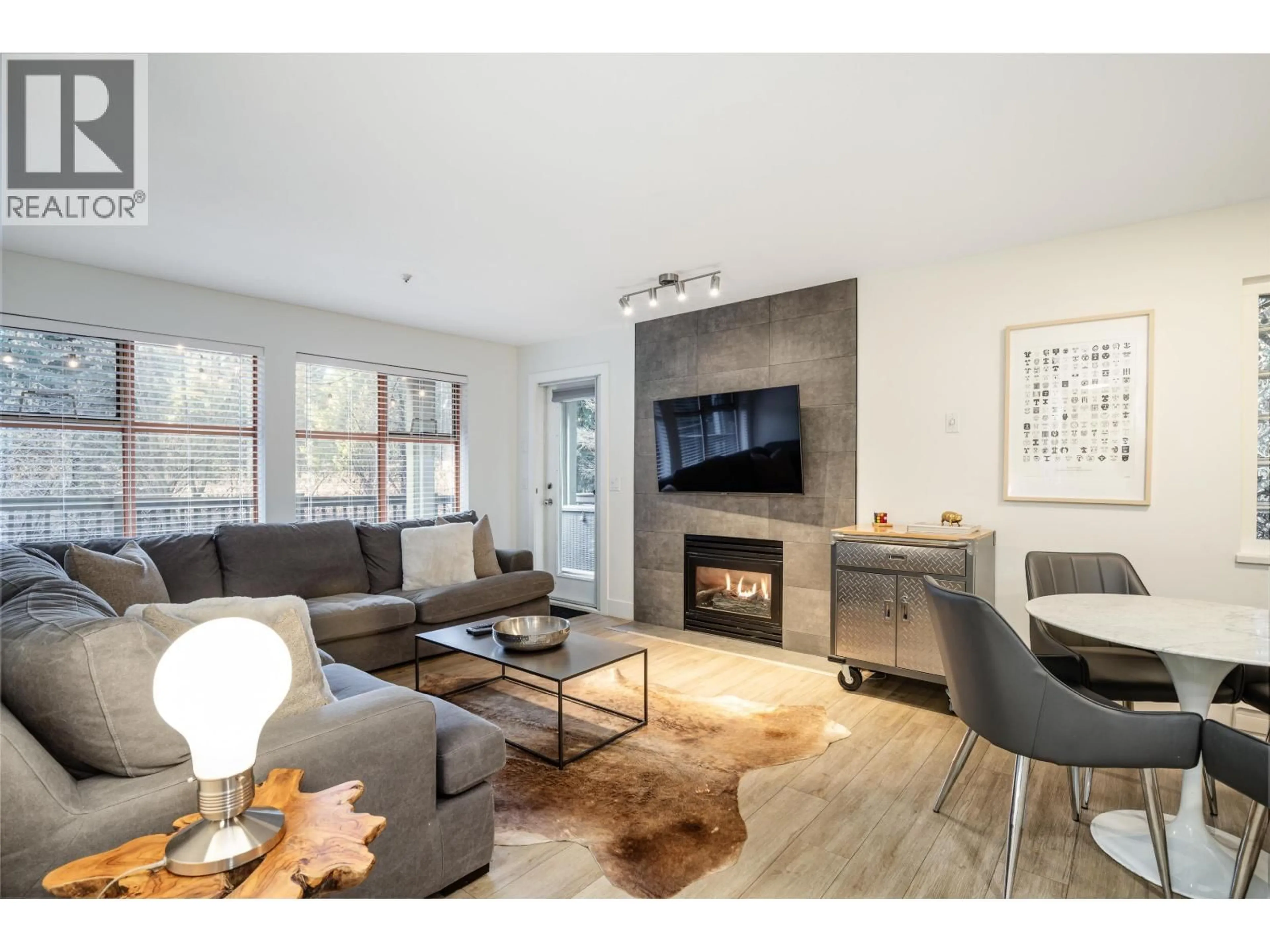 Living room with furniture, wood/laminate floor for 80 - 4355 NORTHLANDS BOULEVARD, Whistler British Columbia V8E1C3