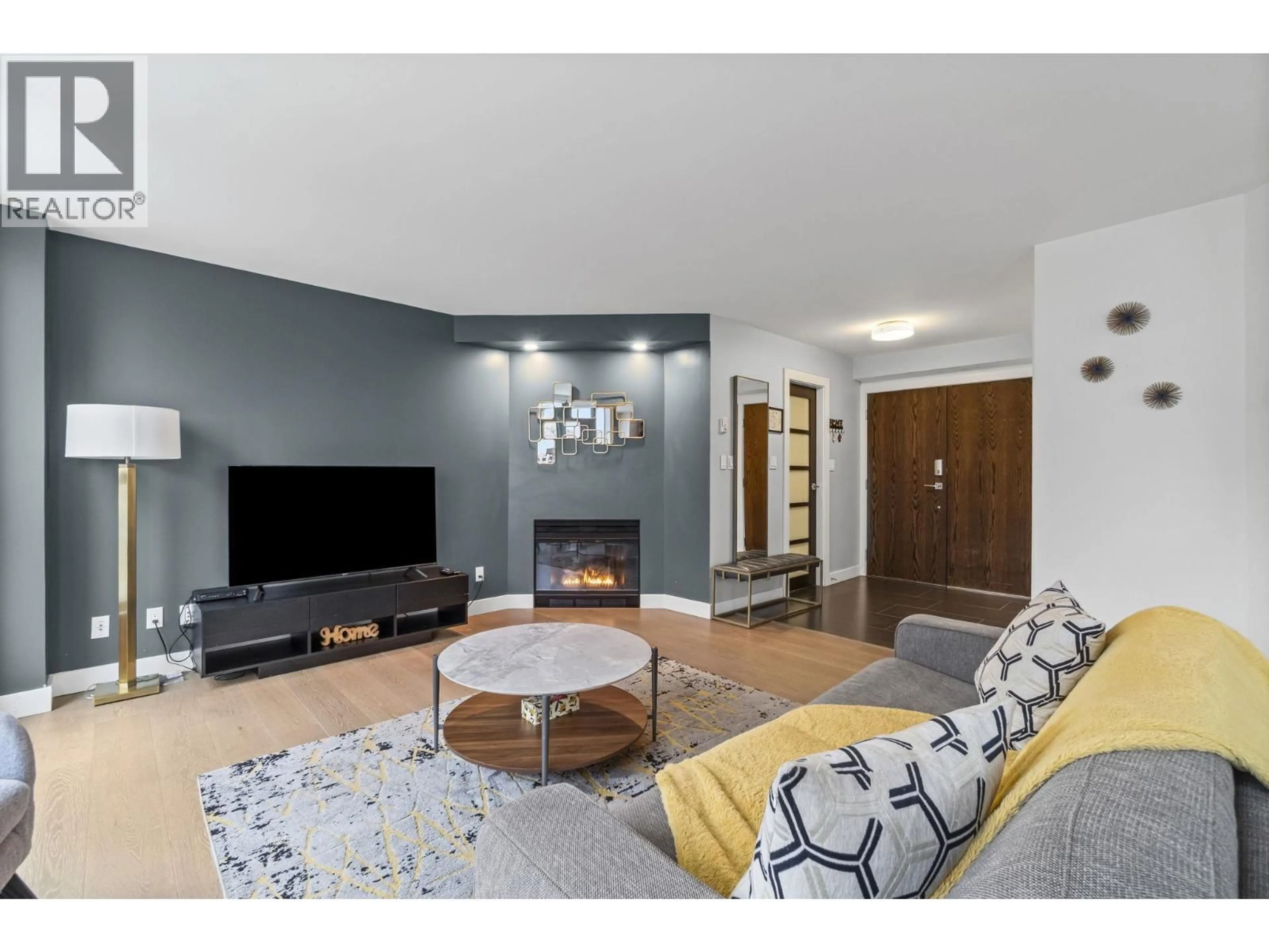 Living room with furniture, wood/laminate floor for 501 - 789 JERVIS STREET, Vancouver British Columbia V6E2B1