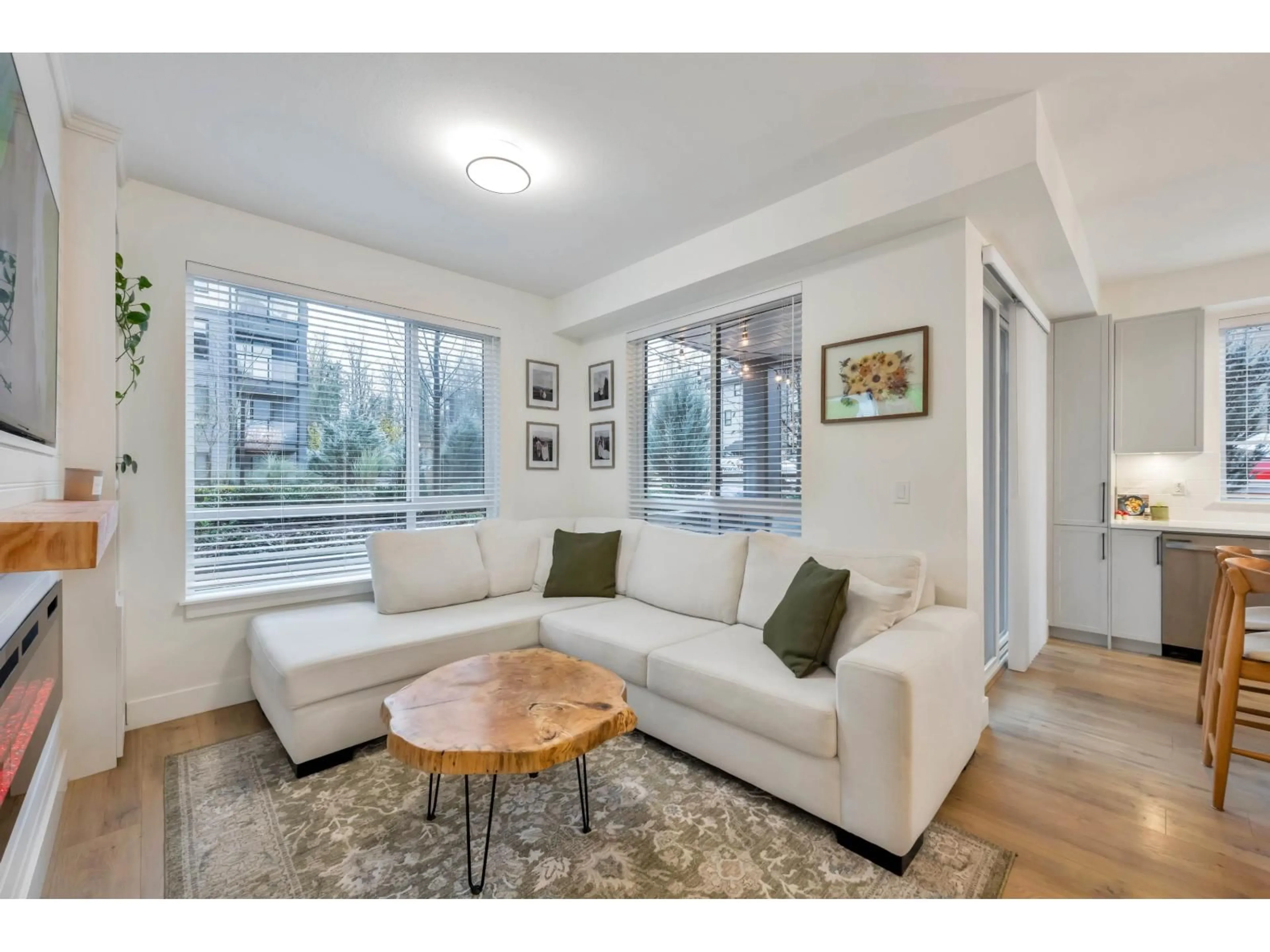 Living room with furniture, wood/laminate floor for 124 - 7506 199A STREET, Langley British Columbia V2Y3K9