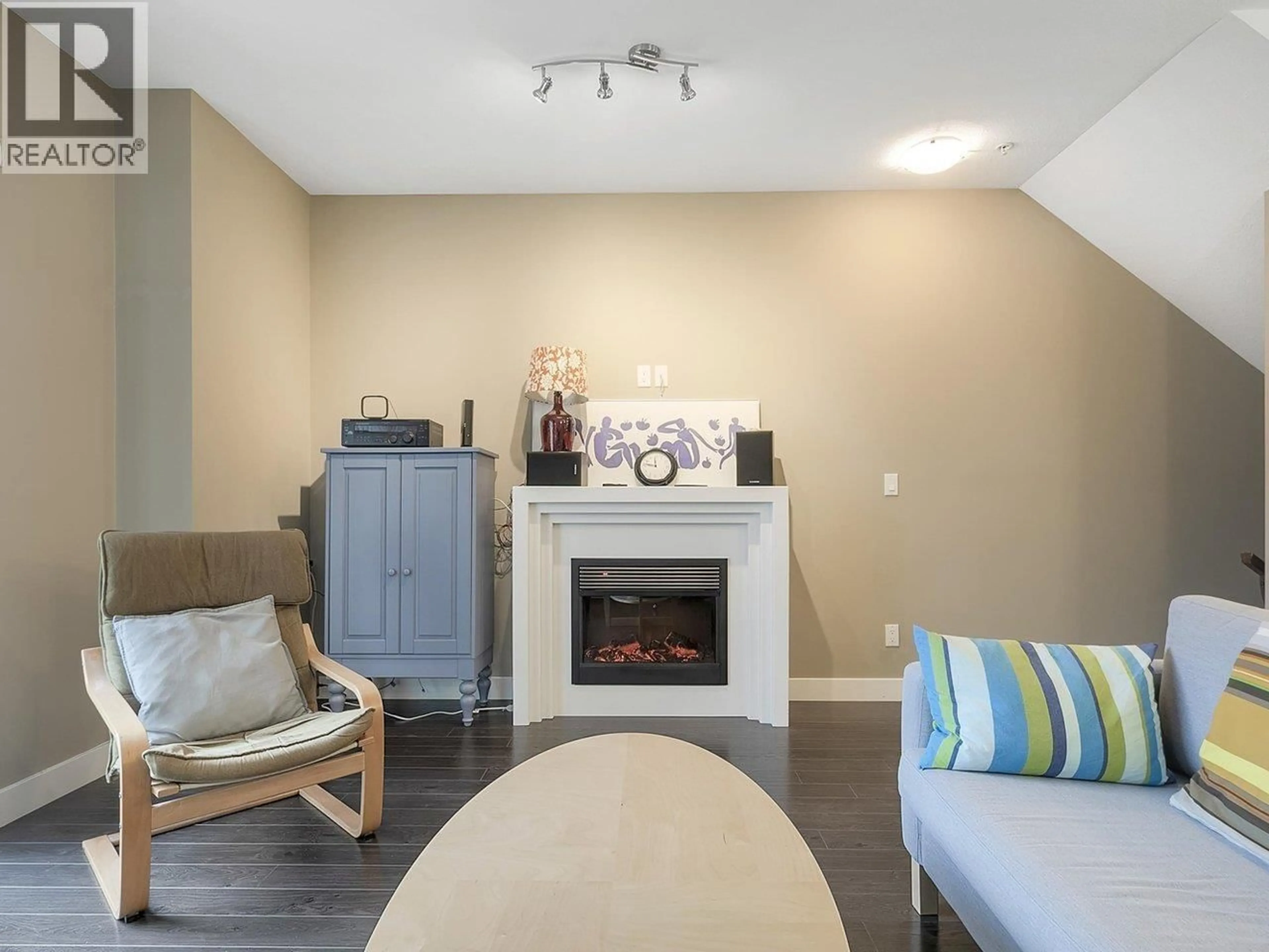 Living room with furniture, wood/laminate floor for 226 - 3888 NORFOLK STREET, Burnaby British Columbia V5G1E5