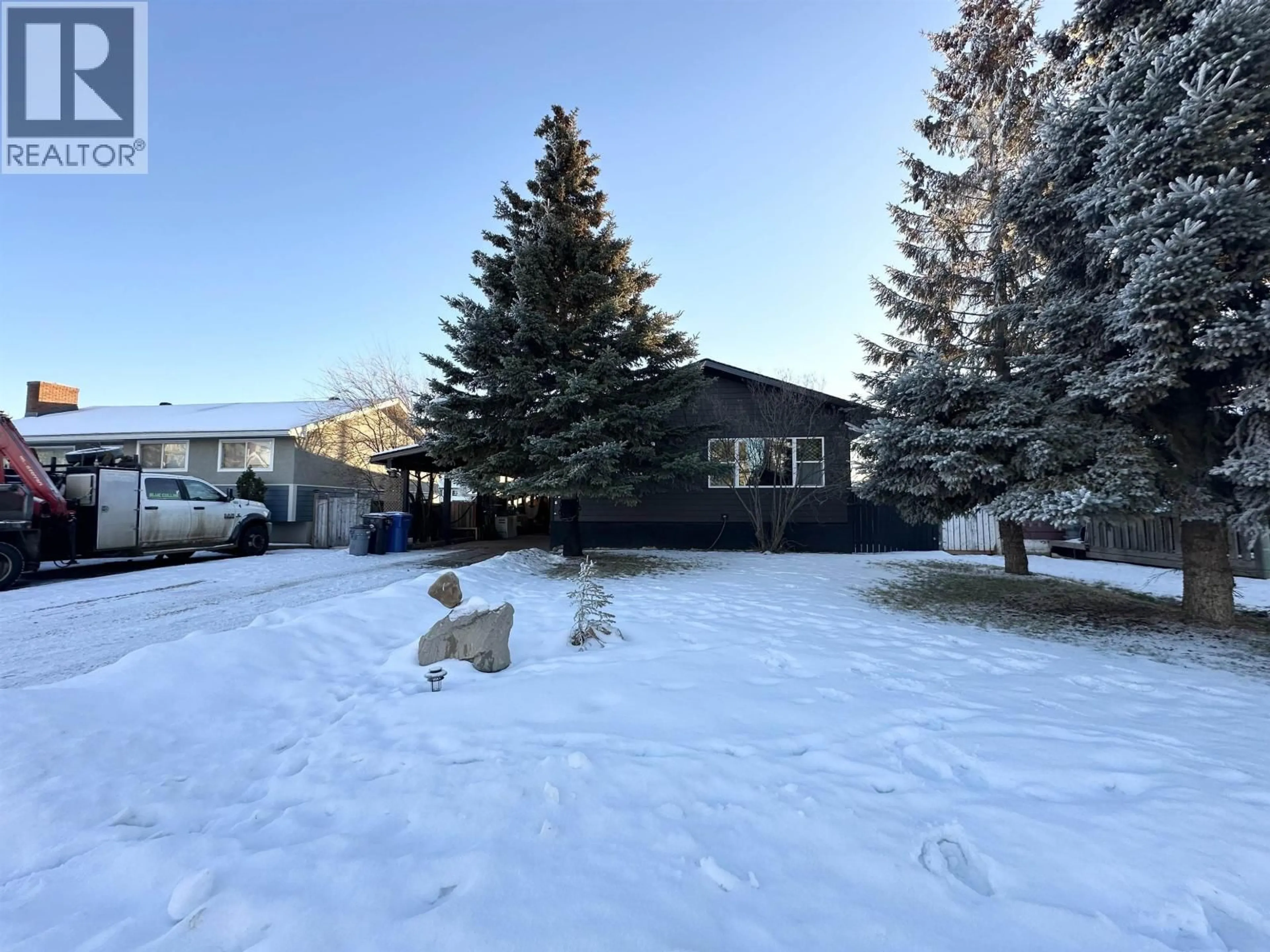 A pic from outside/outdoor area/front of a property/back of a property/a pic from drone, mountain view for 11107 102 AVENUE, Fort St. John British Columbia V1J2G2