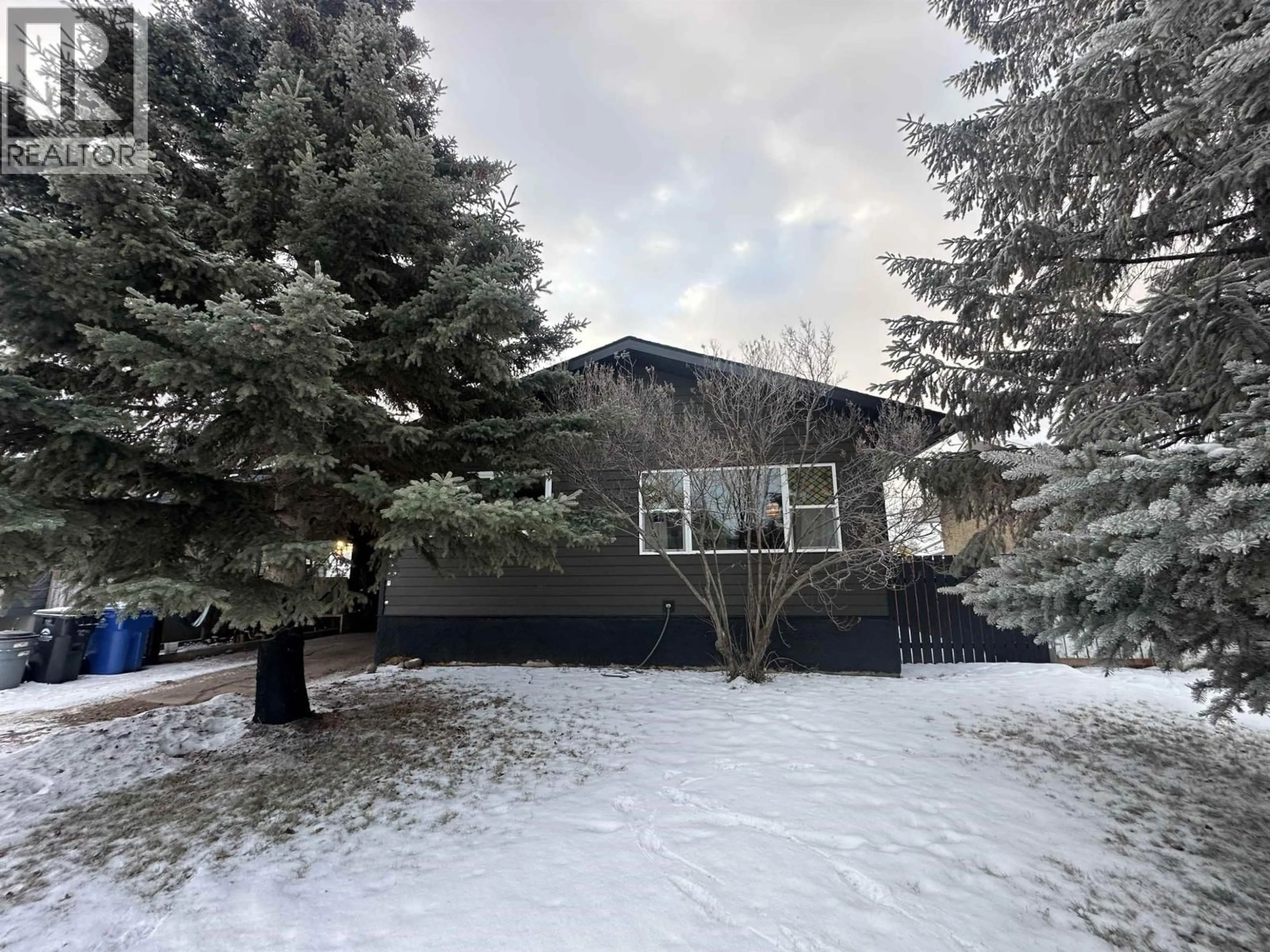 A pic from outside/outdoor area/front of a property/back of a property/a pic from drone, unknown for 11107 102 AVENUE, Fort St. John British Columbia V1J2G2