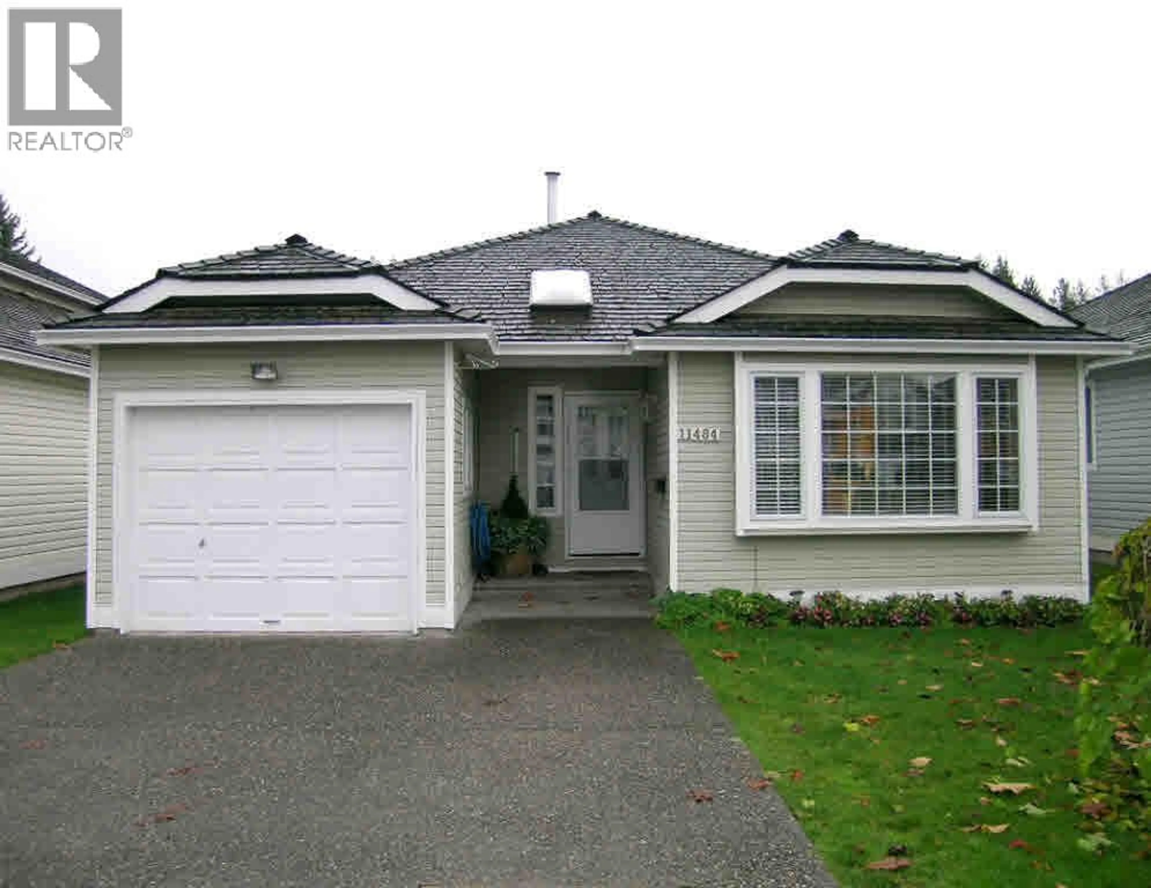 Home with vinyl exterior material, street for 11484 207 STREET, Maple Ridge British Columbia V2X1X1