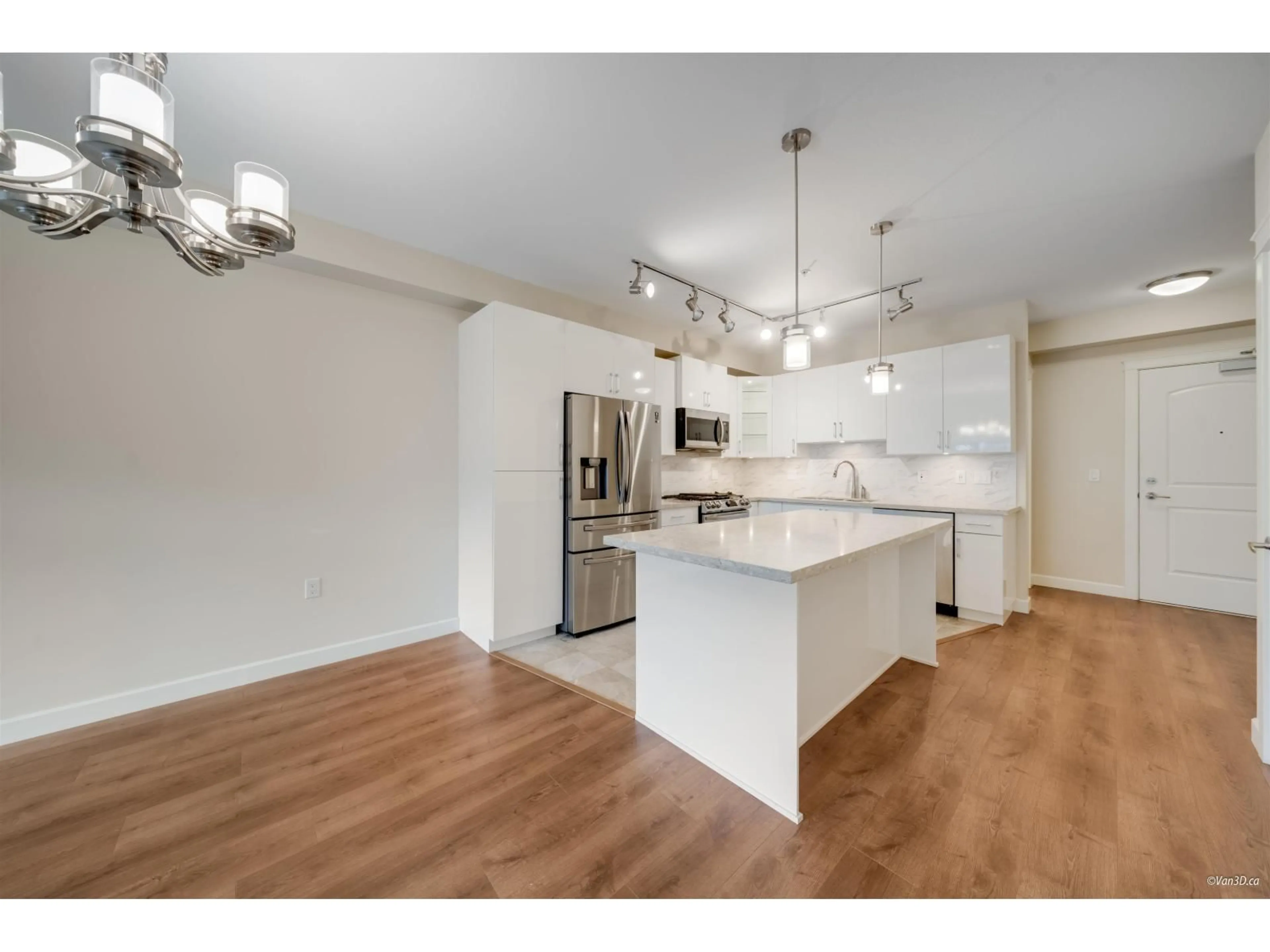 Open concept kitchen, wood/laminate floor for 305 - 8561 203A STREET, Langdale British Columbia V2Y3L7