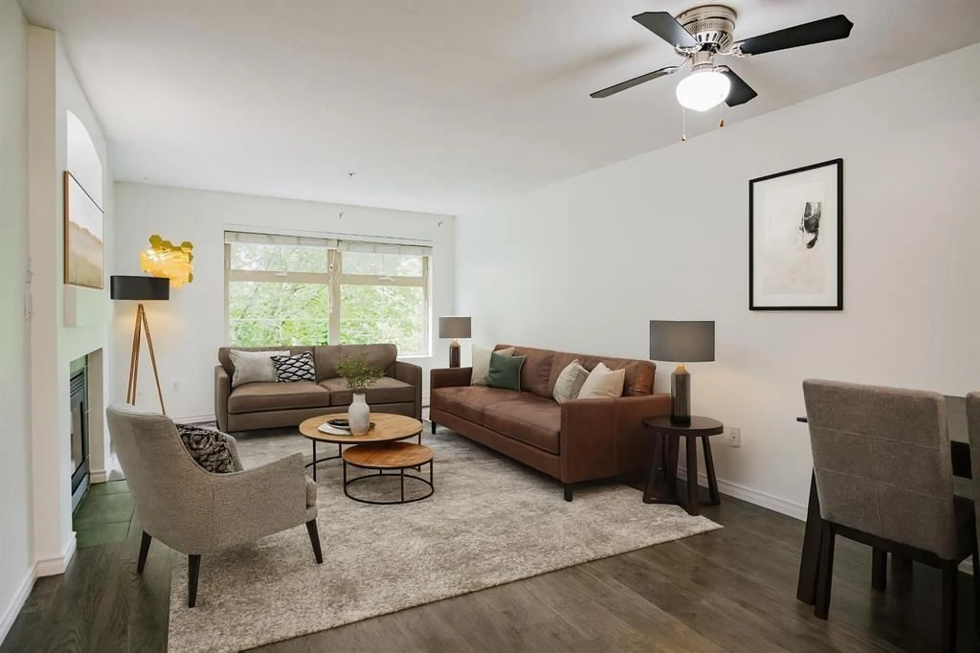 Living room with furniture, wood/laminate floor for 307 - 15210 GUILDFORD DRIVE, Surrey British Columbia V3R0X7